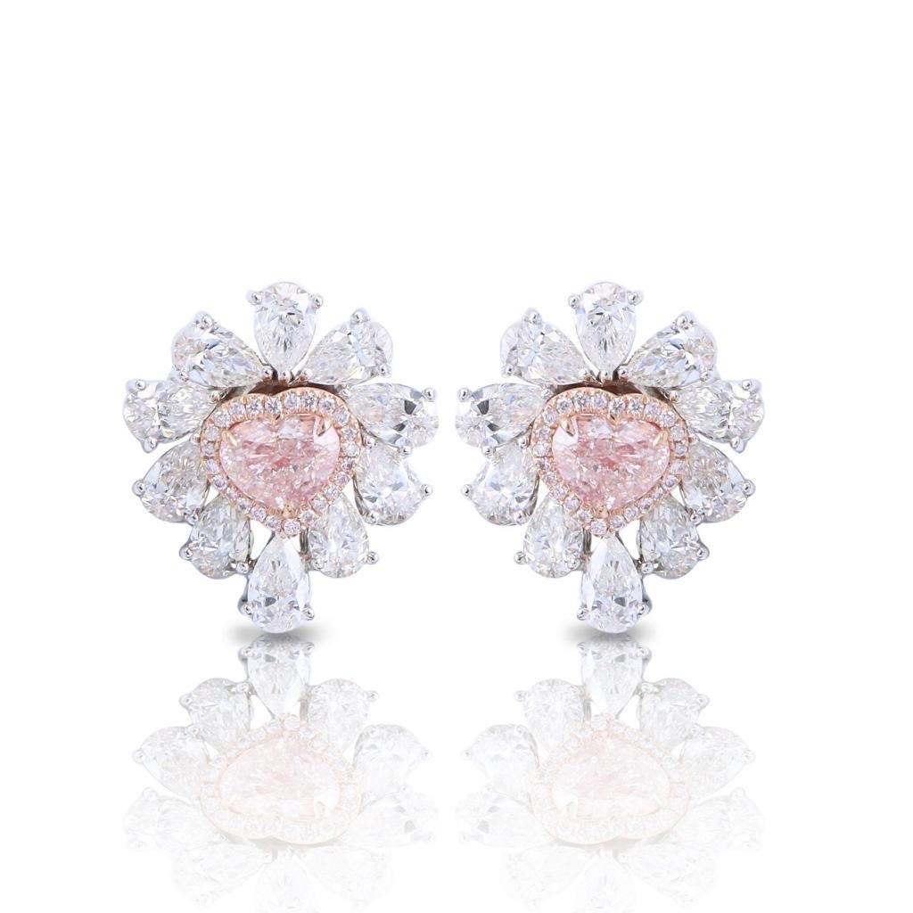 From the Museum Vault at Emilio Jewelry located on New York's iconic Fifth avenue, 
The focal point of these magnificent earrings feature 2 heart shape natural Fancy light Pink diamonds totaling 3.00 carats. Please inquire for details. An additional