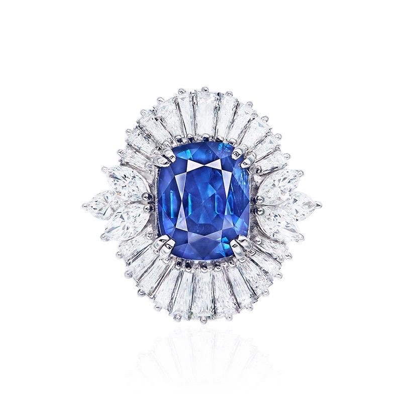 From the vault at Emilio Jewelry, a dealer located on New York's iconic 5th Avenue,
Center Stone: Gia certified no heat 4.90ct + Burmese Sapphire 
Matching: White diamonds total about 4.29 carats set in Platinum.	
Burmese sapphires require extreme