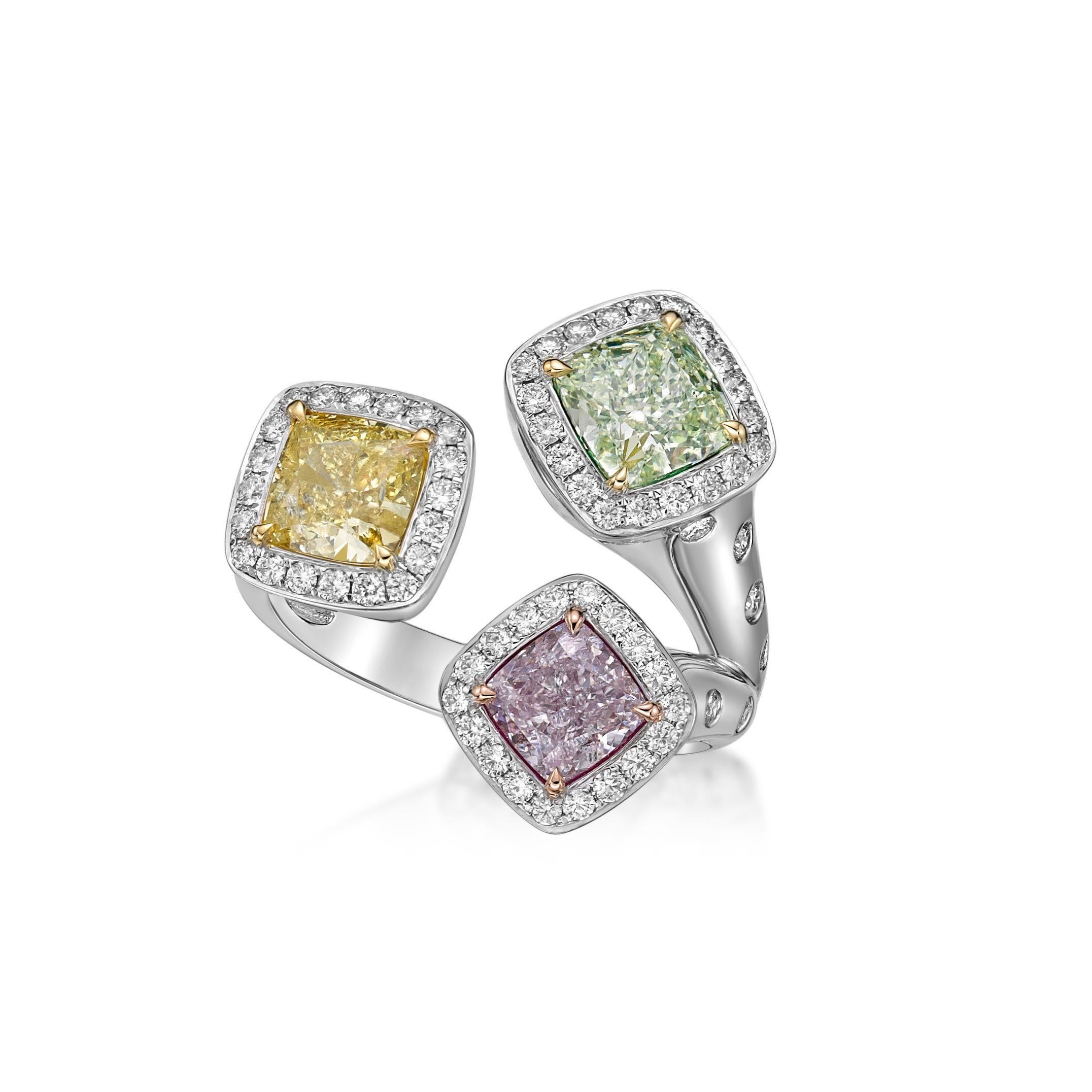 3 Gia Certified Natural cushion diamonds weighing over 1.00 Carats each totaling over 3.00 Carats...Pink yellow and green diamonds. 
In addition 72 small diamonds totaling .59ct
From The Museum Vault at Emilio Jewelry Located on New York's iconic