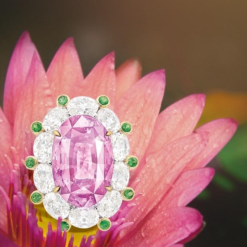 From the Museum vault at Emilio Jewelry, a dealer located on New York's iconic 5th Avenue,

Center Stone: Grs Certified weighing over 10.00ct as Padparascha with a Pastel Orangy-Pink color 
Setting: 28 white diamonds totaling about 5.00 carats, 10