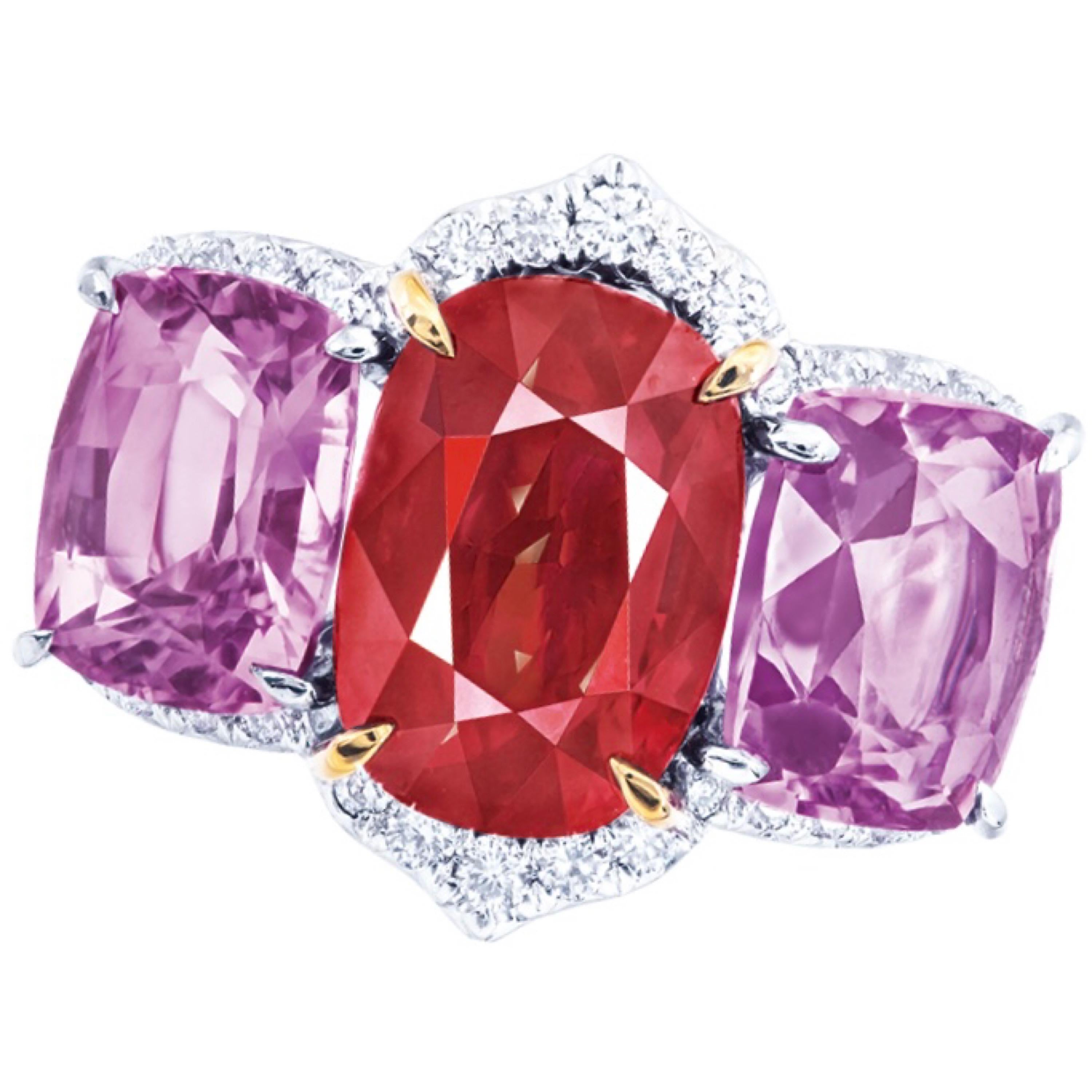 From the Emilio Jewelry Museum Vault, Showcasing a stunning certified 5.00 carat unheated/untreated vivid red-pigeons blood clean ruby set in the center. The side stones are sapphires totaling 5.00cts in addition. .36ct in white diamonds. 
We are