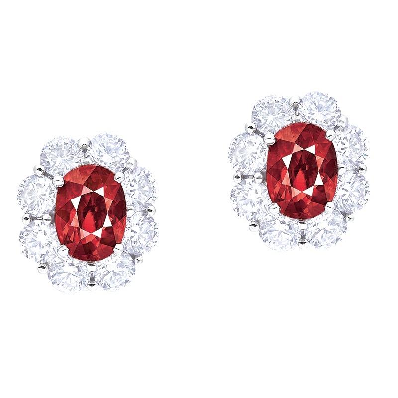 From the Emilio Jewelry Museum Vault, Showcasing a stunning pair of Grs certified 6.00 carat natural vivid red-pigeons blood clean rubies set in the center. The origin of the rubies are Mozambique, very well known for producing fine quality rubies.