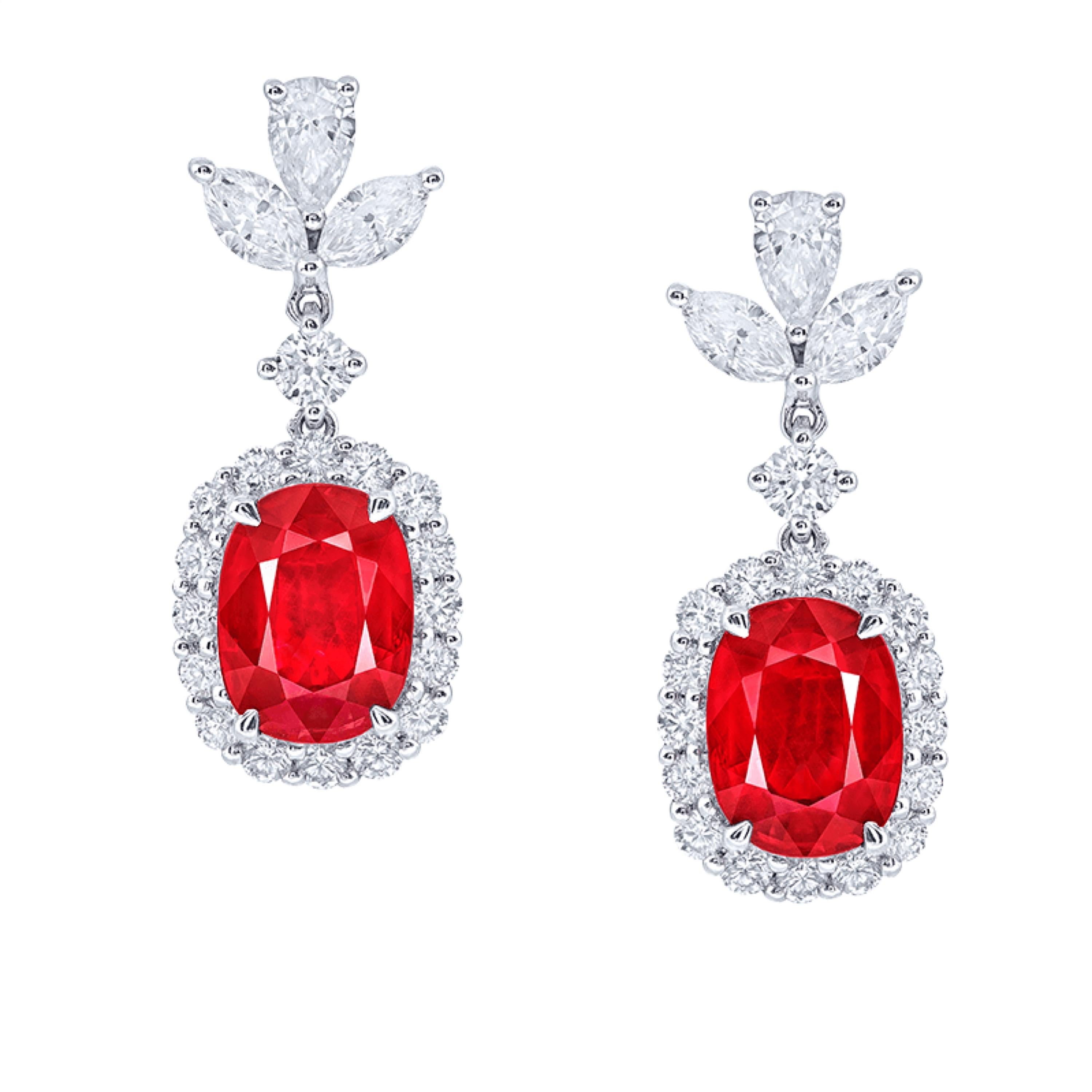 Two center rubies: 2.13 carats Vivid Red OVAL, 2.08 carats Vivid Red OVAL
Setting: 4 fancy-cut marquise white diamonds with a total of about 0.47 carats, 2 fancy-cut water drop white diamonds with a total of about 0.31 carats, 34 round white