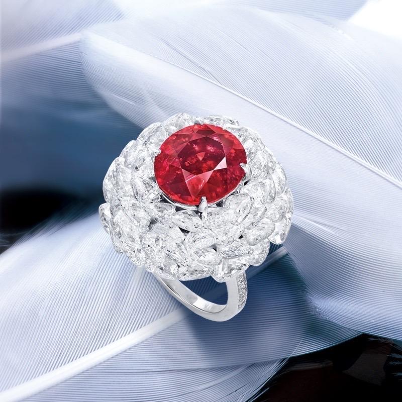 From the Museum Vault at Emilio Jewelry, a dealer located on New York's iconic 5th Avenue,
Center Stone: a magnificent Gubelin and Grs certified uneheated Mozambique ruby weighing just over  6.00 carats. 
Setting: White diamonds totaling