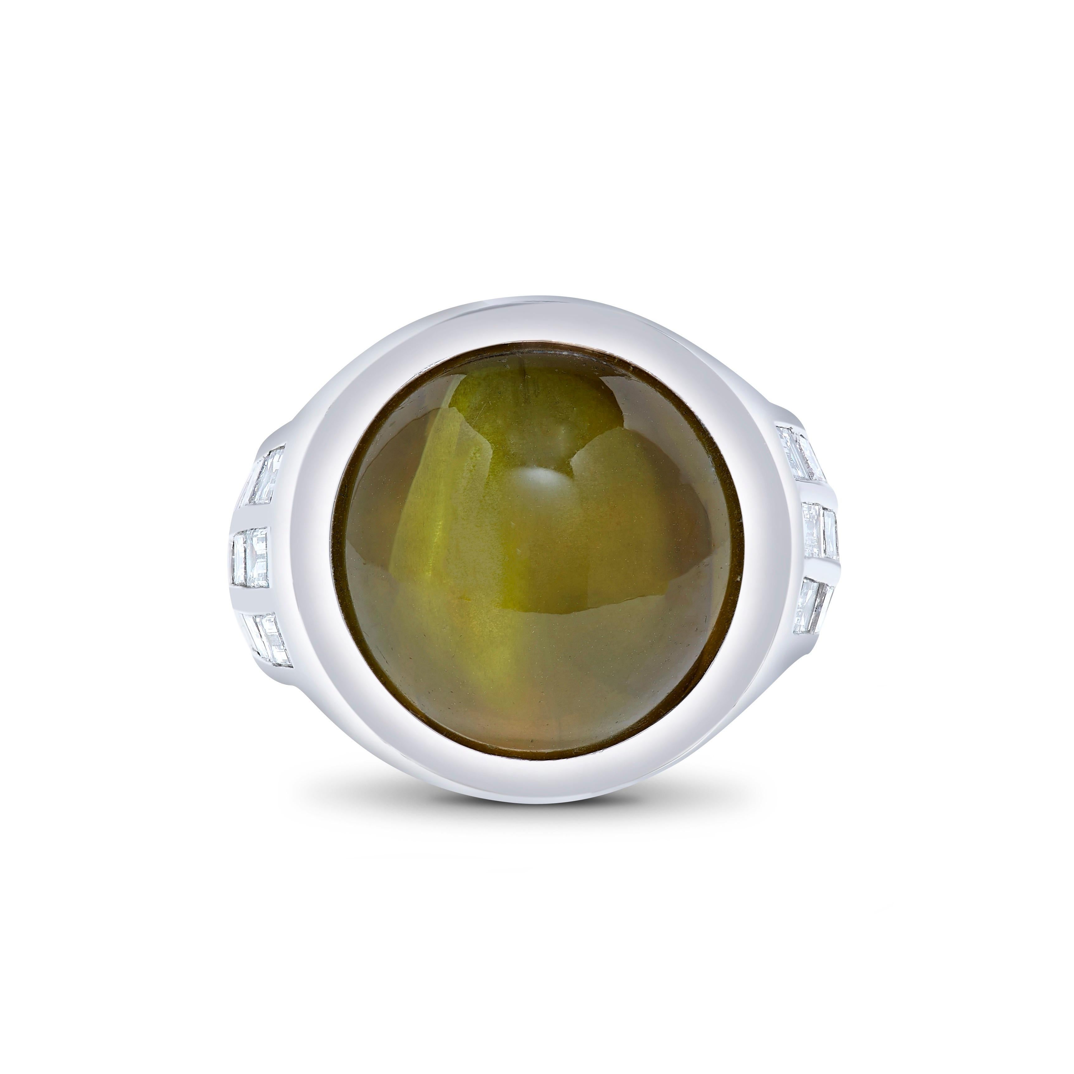 From the vault at Emilio Jewelry New York,
Featuring a super fine rare cats Eye weighing 48.85 carats.  An additional 1.43cts of diamonds make up this simple yet striking ring. Please inquire for details. 
