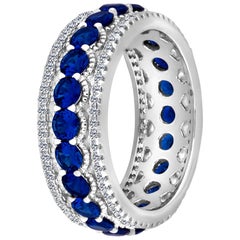 Emilio Jewelry, bague d'éternité en platine avec saphir bleu et diamants