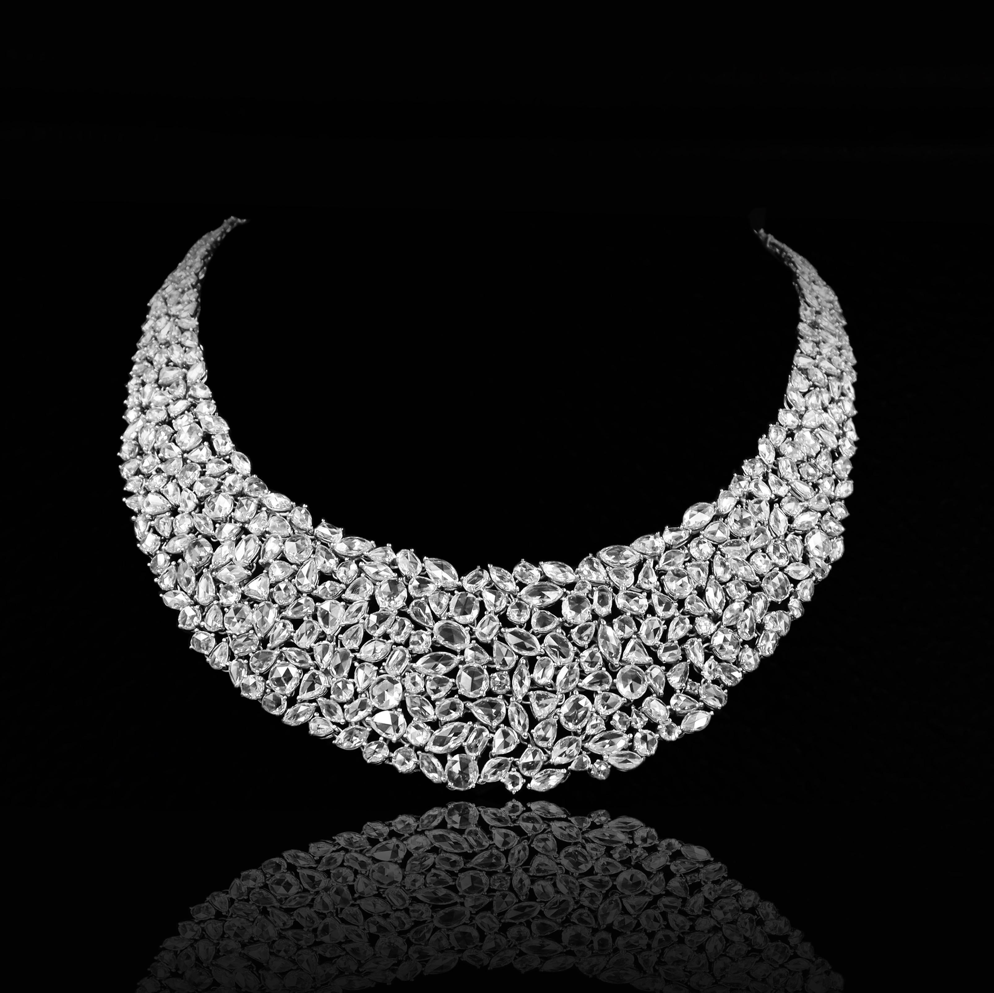 From the vault at Emilio Jewelry, located on New York's iconic Fifth avenue,
One of a kind hand made natural Rose Cut Diamond necklace featuring approximately 59.53 Carats of colorless diamonds ranging in Vvs1-Vs2 clarities. Length Can be extended