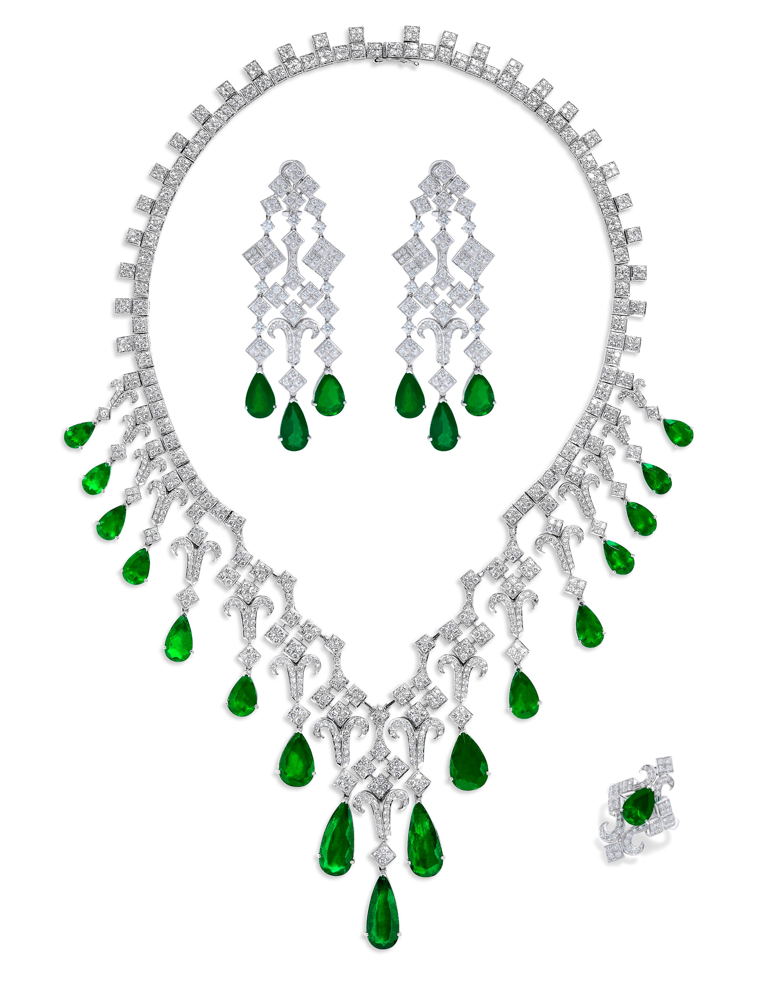 From the Museum vault at Emilio Jewelry, Located On New York’s Iconic Fifth Avenue:
Showcasing a magnificent suite of Vivid green Colombian emeralds with excellent transparency set in a Red carpet suite. 
Total approximate weights: emeralds 69.18ct