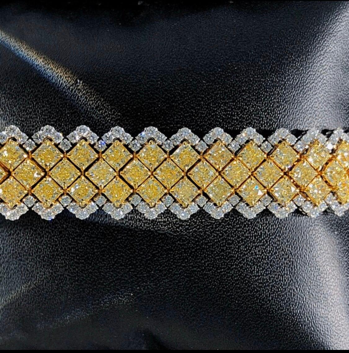 Showcasing an astonishing 24 carats total weight this bracelet is jaw dropping! 99 radiant cut yellow diamonds totaling 20.25ct and 264 round white diamonds totaling 3.92ct. All lengths available this one is 7