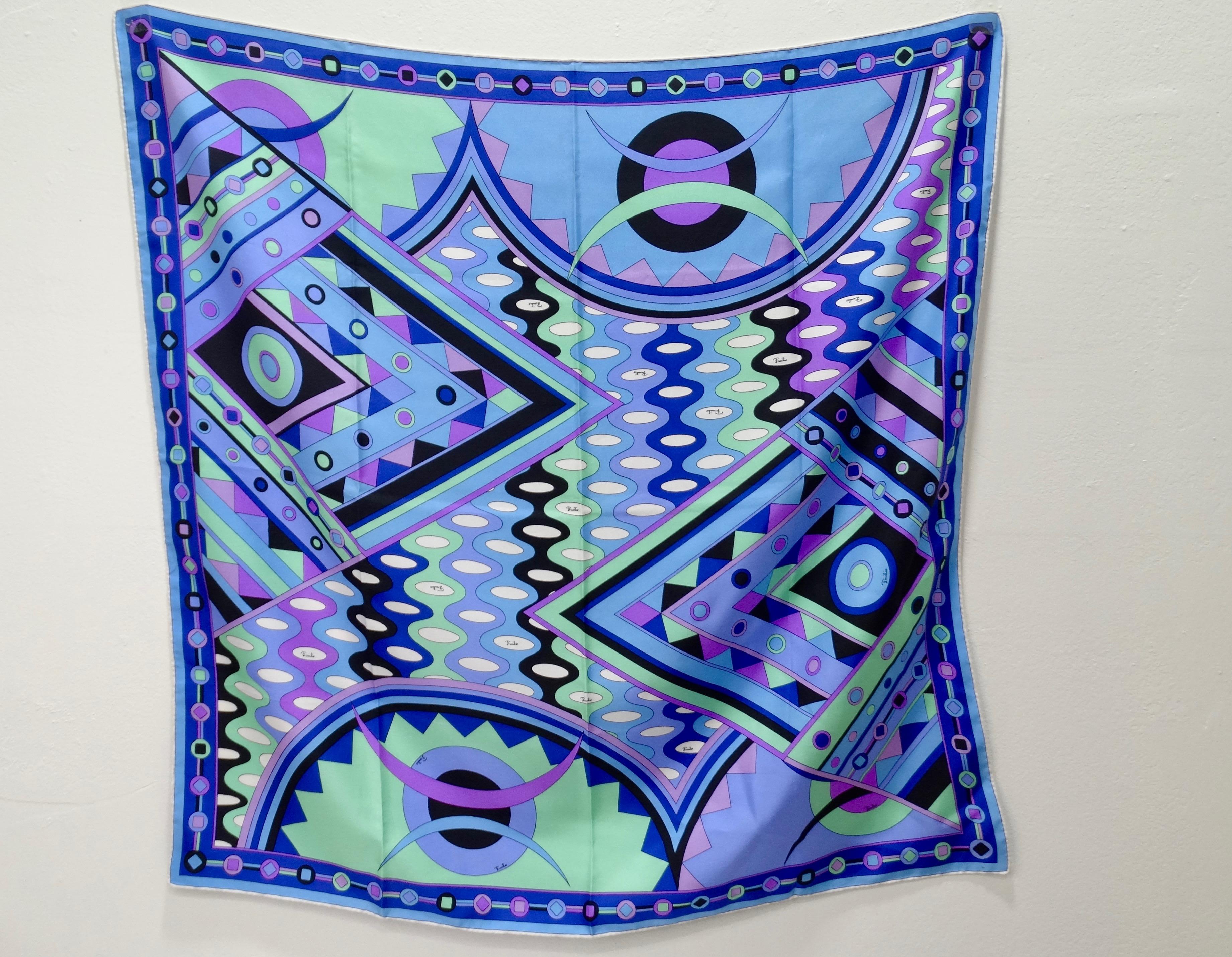 It's never a bad time for some Pucci! Circa 1960s, this amazing silk scarf features one of Pucci's signature abstract designs with various geometric shapes and vibrant blues, purples and mint green. Colorful and timeless, this scarf will pair