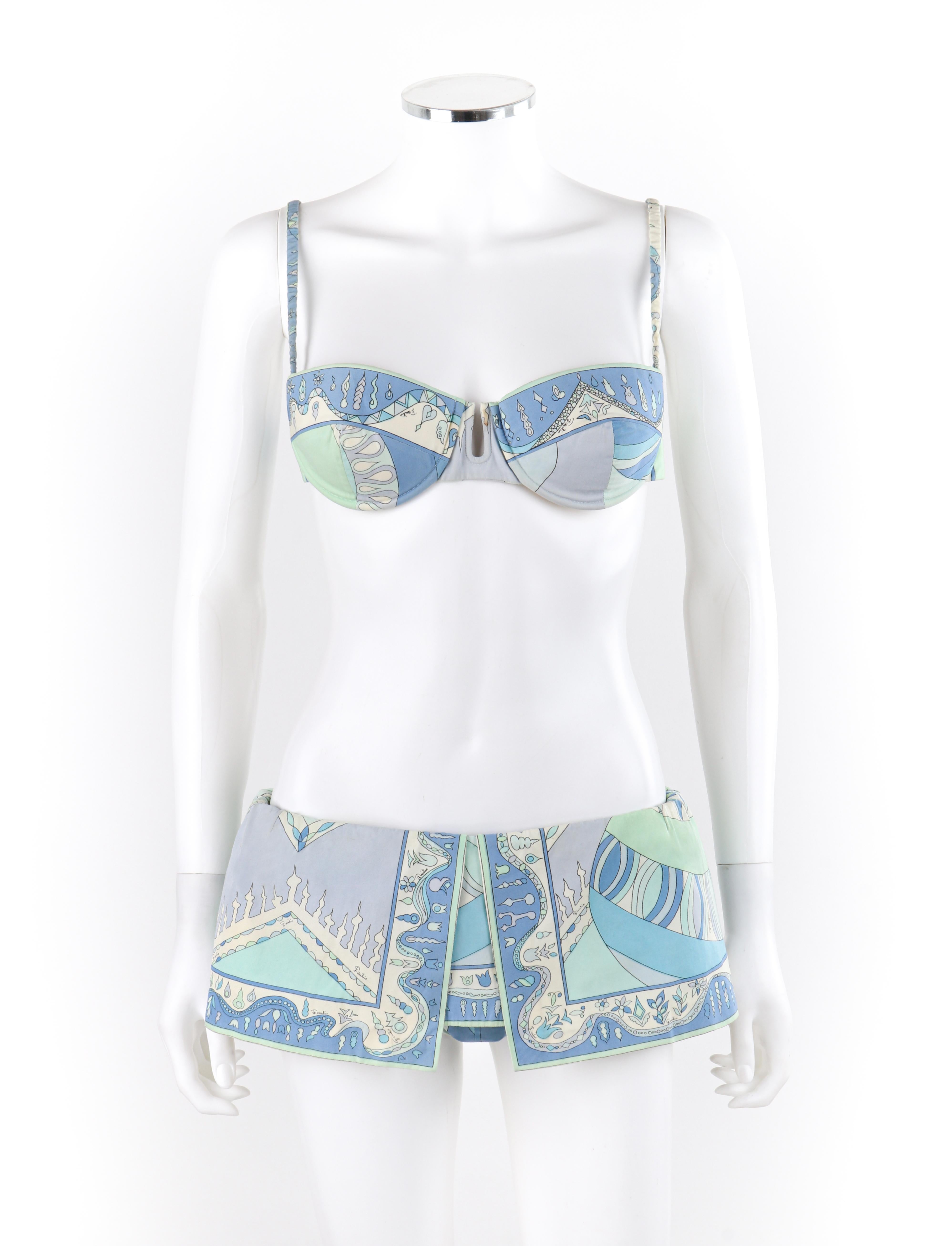 EMILIO PUCCI 1960’s Multicolor Nordic Motif Signature Print 2 Pc Bikini Swimsuit
Circa: 1960’s 
Label(s): Emilio Pucci, Exclusively for Saks Fifth Avenue
Designer: Emilio Pucci
Style: Bikini
Color(s): Shades of blue, green, white, lavender,