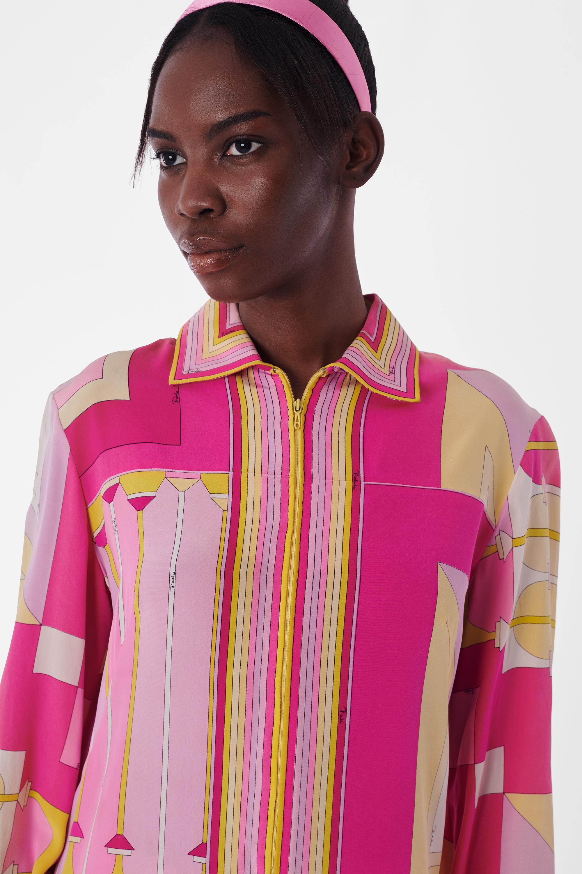 Emilio Pucci Vintage 1960's Pink Silk Zip Up Dress. Features pink and yellow print, long sleeves, collar, concealed front zipper and knee length. In excellent vintage condition.

Label size: UK 12
Modern size: UK: 10, US: 4 to 6, EU: 38
Measurements