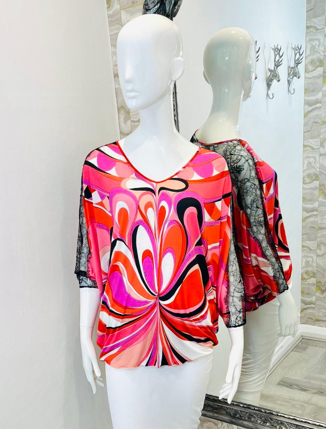 Emilio Pucci Abstract Print Blouse

Multicoloured blouse designed in the shades of pink and red.

Detailed with black lace inserts along the three-quarter sleeves.

Featuring scoop neckline and cut-out accent to rear.

Loose fit silhouette with