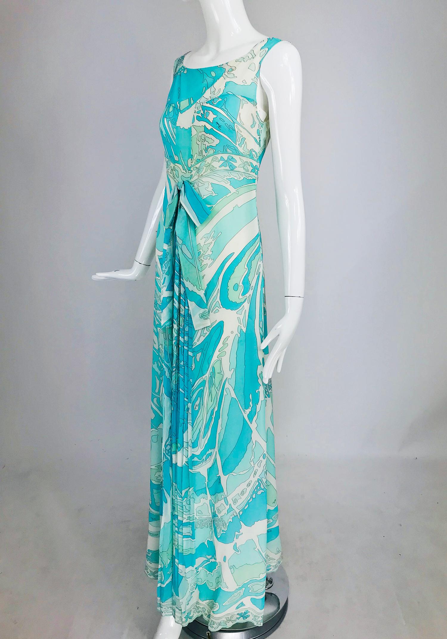 Pucci Aqua Print Silk Chiffon Maxi Dress. Light as air and perfect for summer this gorgeous dress is done in shades of turquoise and aqua blue with off white and ivory. Slip style dress flows to the hem in an A line shape. At the waist front there