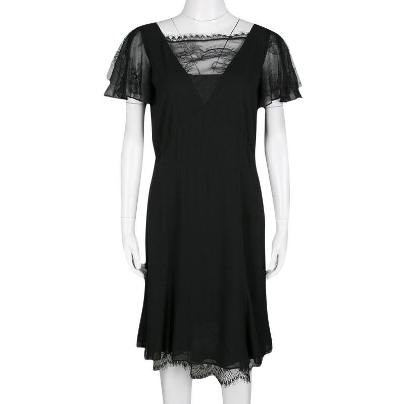 This dress from Emilio Pucci is as delighting as it is gorgeous and stylish. Made from quality fabrics, the dress flaunts lace on the flutter sleeves and on the V neckline. Designed to perfection, this black dress will look fabulous with statement