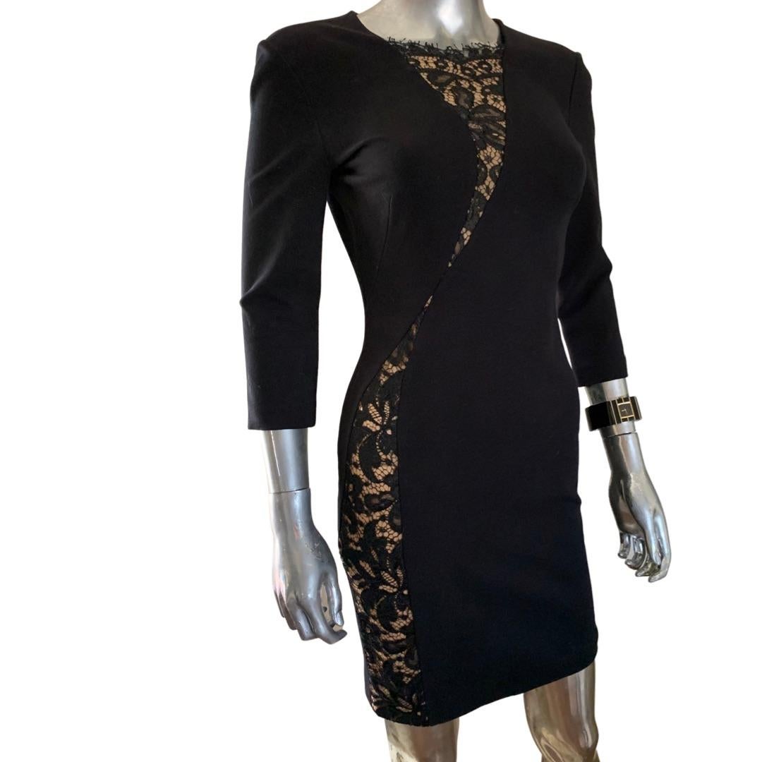 Such a sexy yet chic dress by Emilio Pucci collection. The black knit skims the body. The lace over sheer nude starts at the neckline and curves around the body to the side of the dress to the hem. A very unique and special dress. Size 4, US. Size