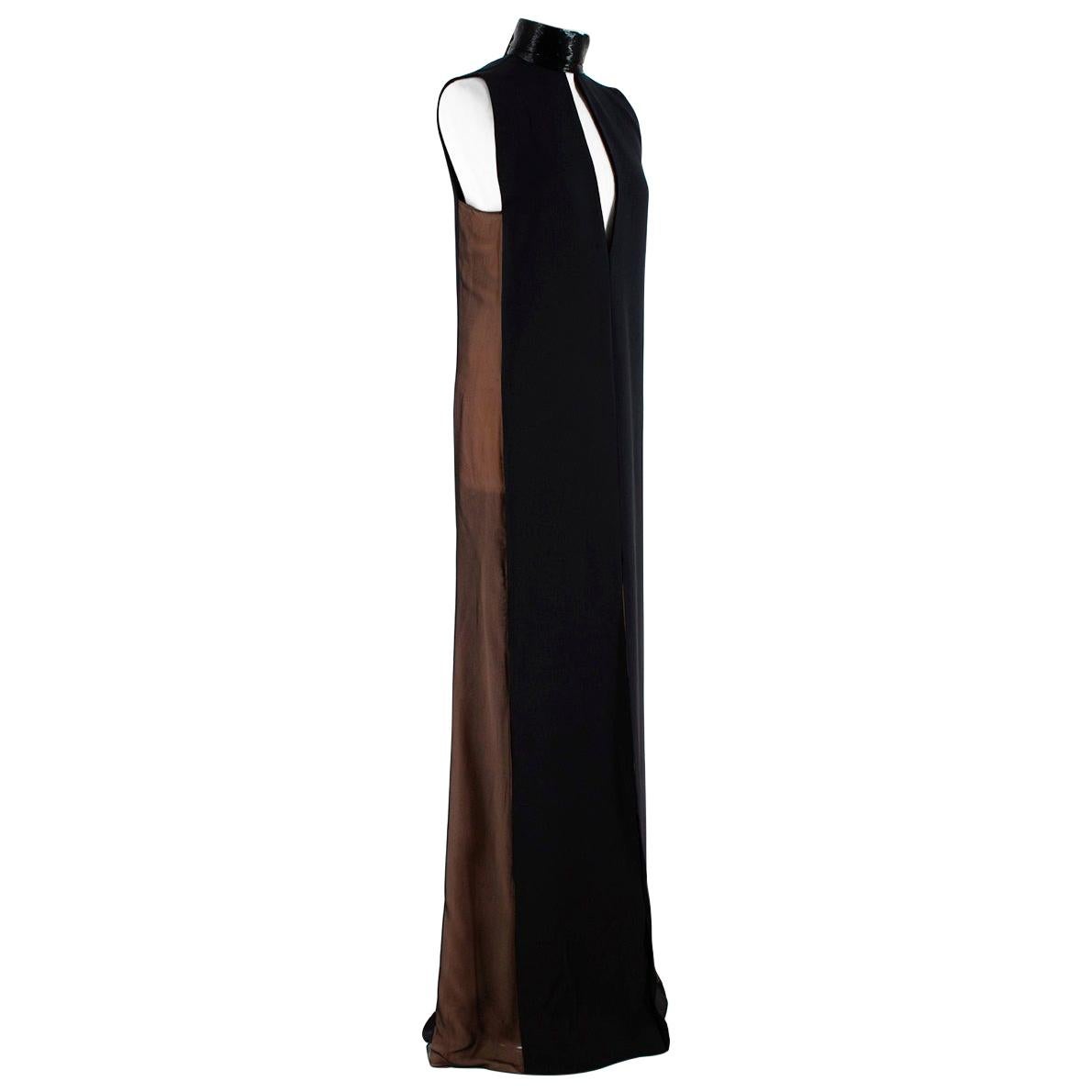 Emilio Pucci Black Silk blend High Neck Beaded Gown

-Extremely elegant high neck design 
-Luxurious beaded hight neck
-Gorgeous triple loop bow like detail to the back  
-Nude side panels to the sides 
-Front slit 
-Deep v shaped back cleavage