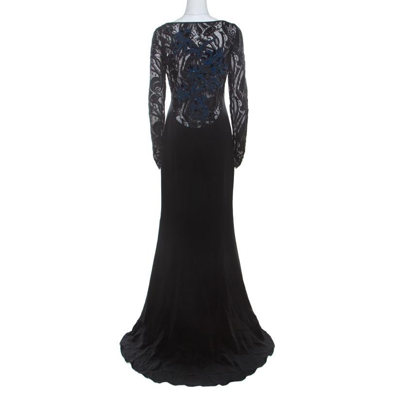 You're ready to slay the audience and channel your inner goddess with this spectacular Emilio Pucci dress. Breathtaking in black, this creation is made of a silk blend and is adorned with beautiful guipure lacework on the long sleeves and sheer