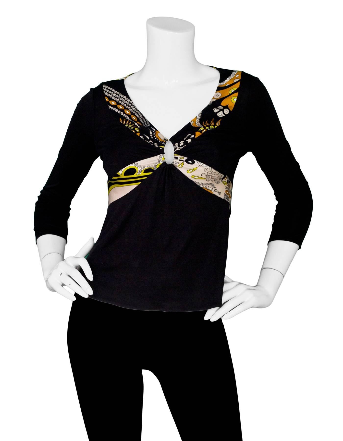 Emilio Pucci Black Silk Top with Keyhole Sz 6

Made In: Italy
Color: Black, beige, rust
Composition: 100% silk
Lining: None
Closure/Opening: Pull over
Overall Condition: Excellent pre-owned condition, general wear
Marked Size: 6
Bust: 30
