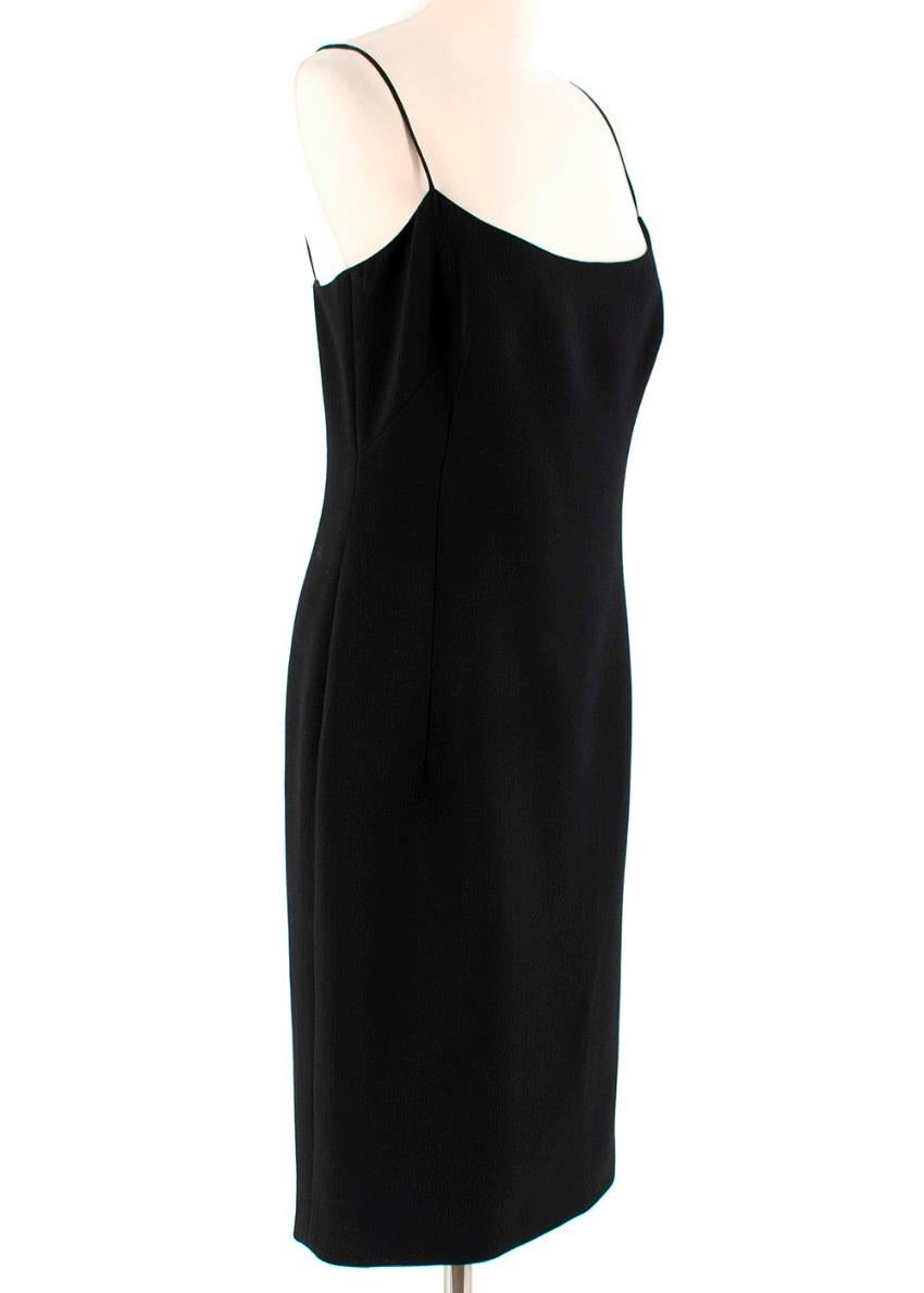 Emilio Pucci Black Wool Slip Dress.

- Spaghetti straps 
- left leg slit
- hidden zip up the back
- Shaping darts around bust 

Materials
98% Wool
2% Elastane 
Lining
92% Silk
8% Elastane 

Made in Italy 

Dry Clean Only 

Please note, these items