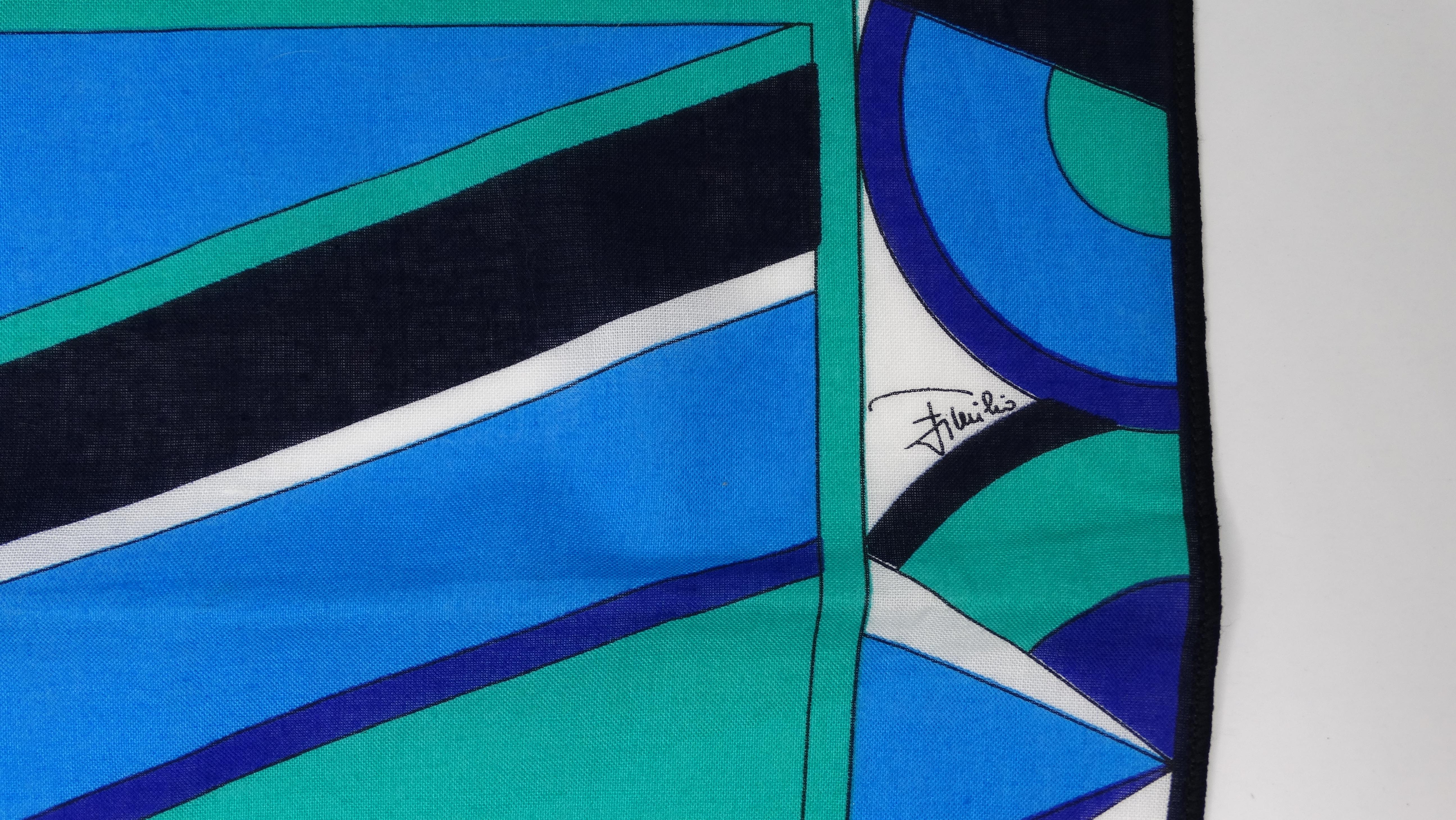 Add this Pucci to your collection! Circa 1960s, this adorable cotton scarf features one of Pucci's signature abstract designs with various shapes in shades of green, blue, black and white. Geometric trim. Emilio Pucci written throughout, made in