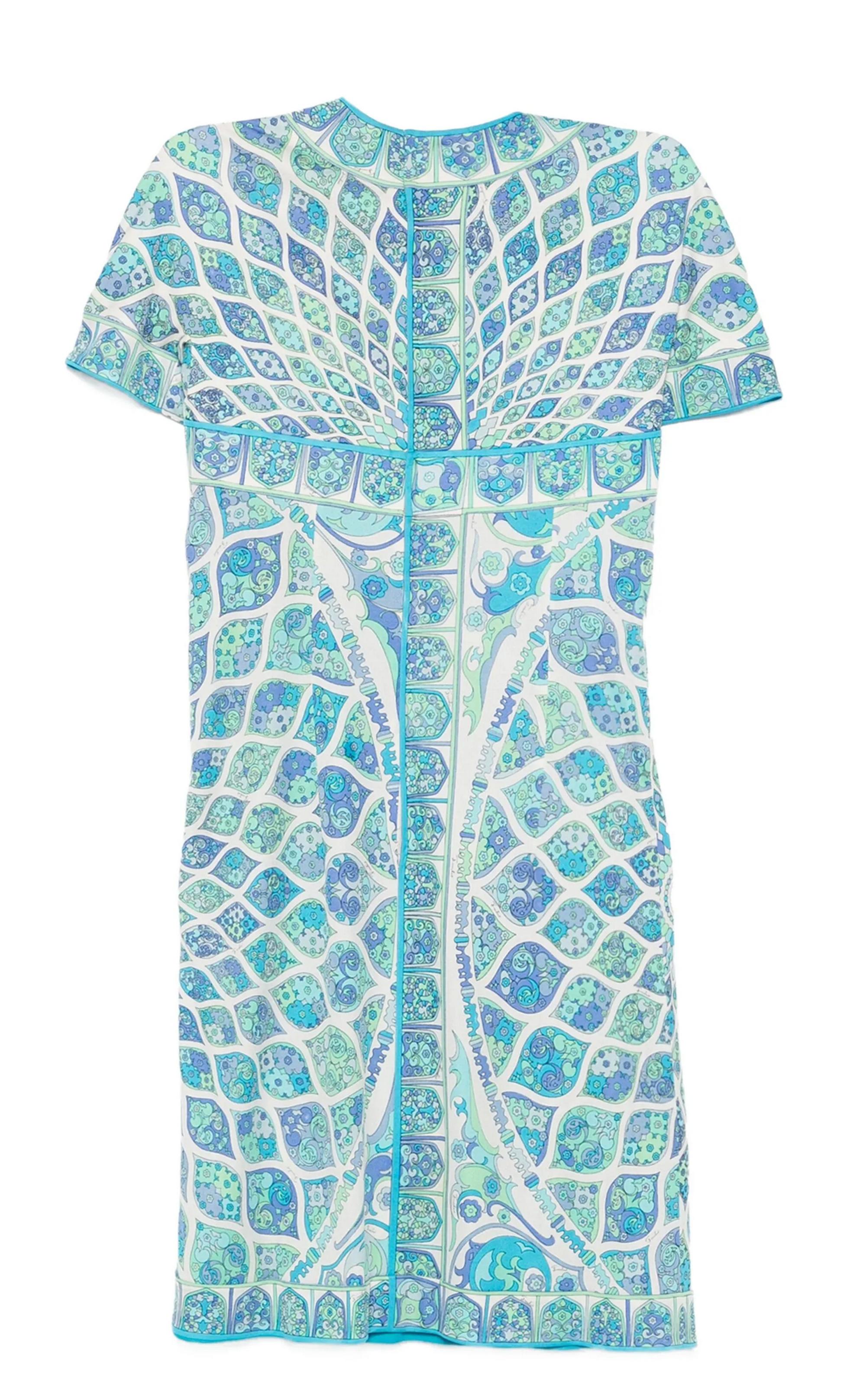 Emilio Pucci 1970s geometric-pattern blue silk dress featuring an iconic geometric print, a wrap-effect leading, a rear zipper closing.
Circa 1970s In good vintage condition. 
Composition: 100% silk Made in Italy. 
Estimated size 36fr/ US4/ UK8
We