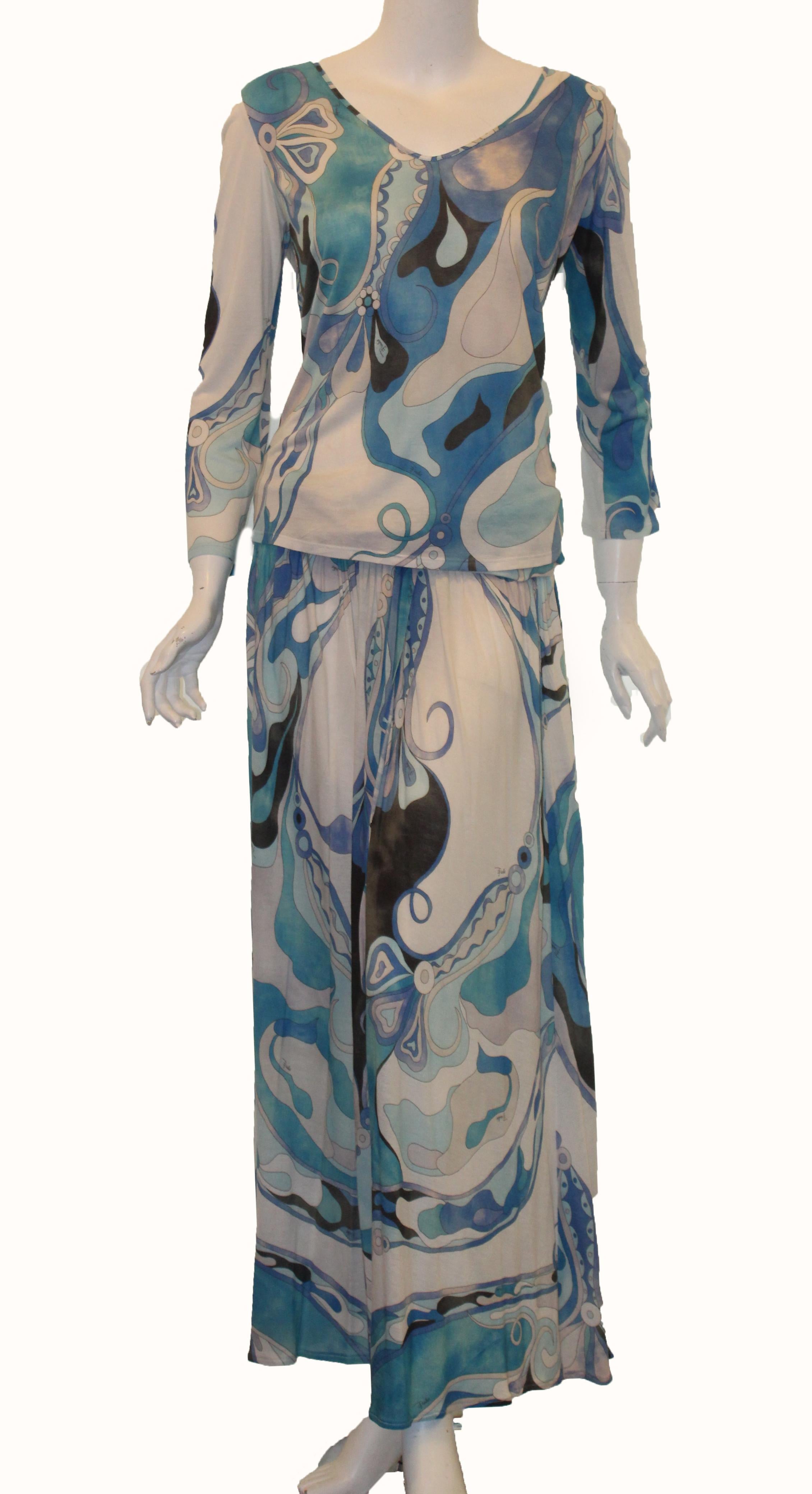 Emilio Pucci blue tones abstract iconic design in this top and long skirt set can be worn together or individually.  This vintage 2 piece ensemble incorporates a long sleeve boat neck collar top and a long skirt with drape accent at waist and slit