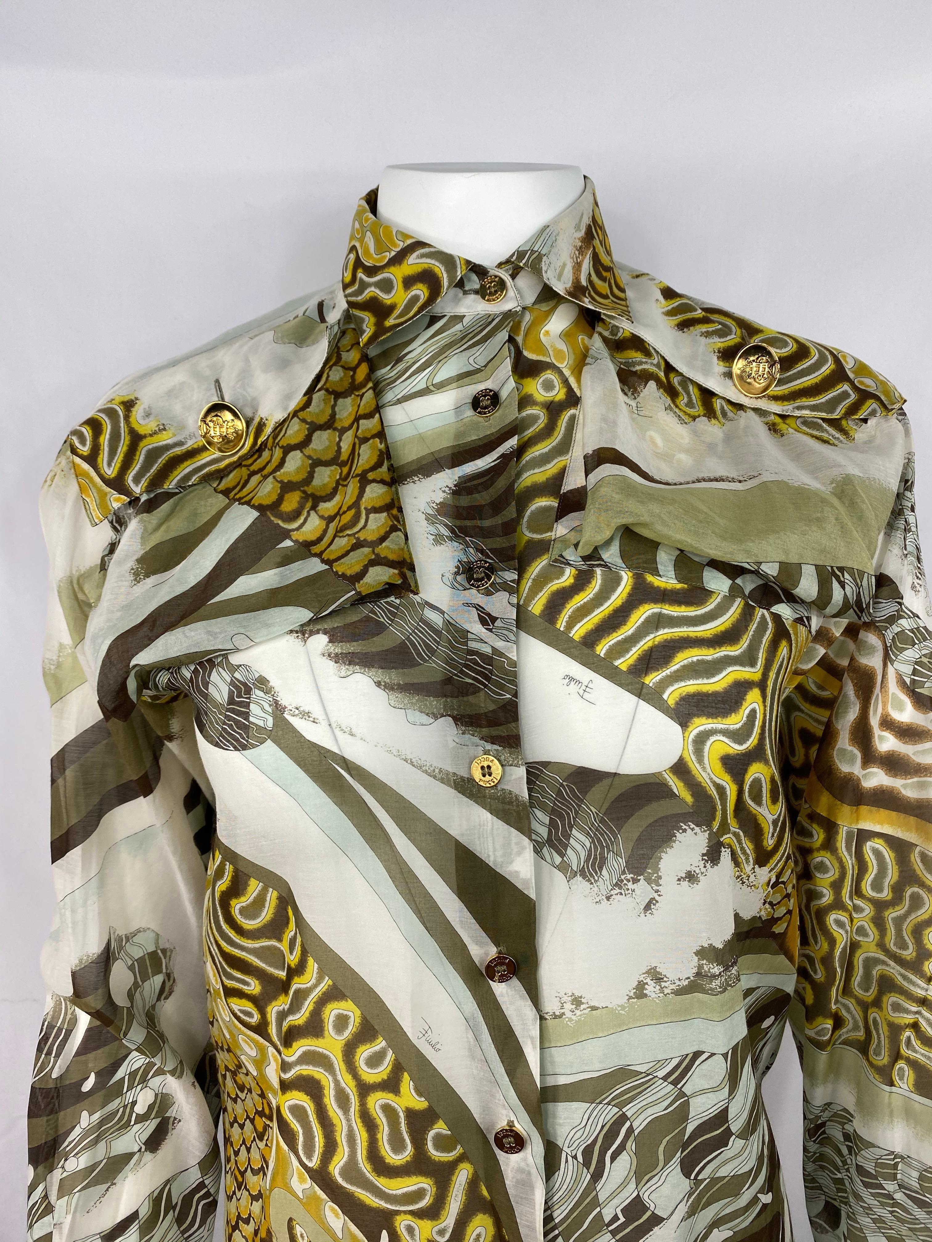 Product details:

Featuring silk and cotton blend, brown, white, blue, yellow and green abstract print, front gold tone buttons closure, stamped  PUCCI, dual front pockets  located at the shoulder area with the large gold tone button, collar and
