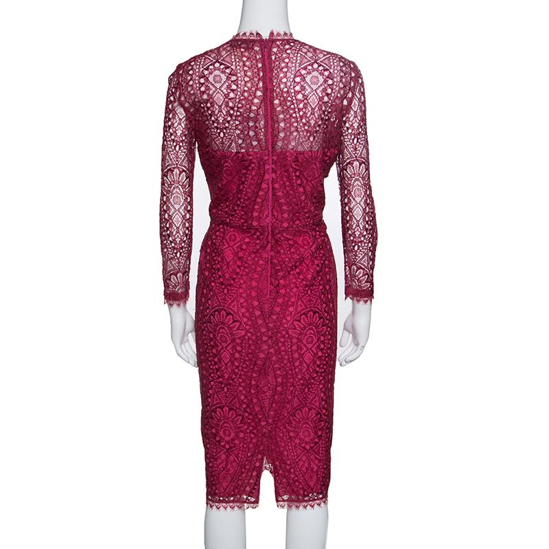 The crowds won't be able to take their eyes off you when you step out in this gorgeous dress from Emilio Pucci. The burgundy creation is made of a blend of fabrics and features an exquisite floral lace pattern all over. It flaunts a round neckline,