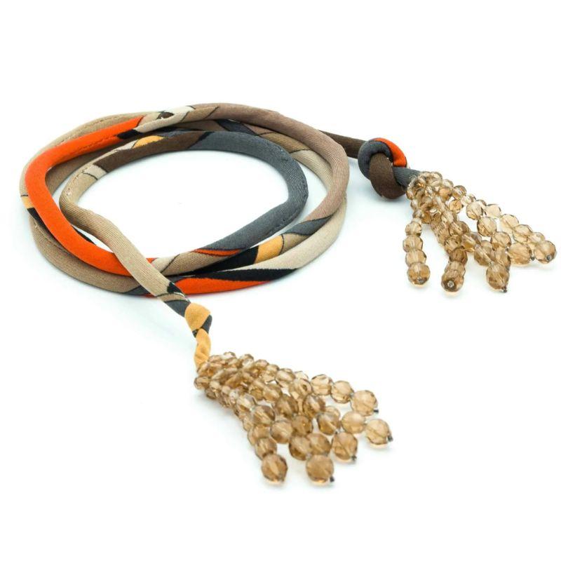 Fashion and collectable Emilio Pucci by Coppola e Toppo Vintage Tie Necklace/Belt, 60s. 
Pucci print and brown crystal faceted beads. 

Excellent vintage condition

Size: Total lenght: 150 cm
Signed Pucci on fabric. 

