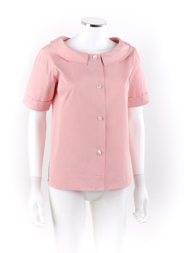 EMILIO PUCCI c.1950’s Pink Button Up Short Sleeve Blouse Top
Circa: 1950’s 
Label(s): Emilio Capri S.R.L.; Made in Italy for Lord & Taylor
Designer: Emilio Pucci
Style: Button up blouse
Color(s): Pink
Lined: No
Marked Fabric Content: “100% Cotton”