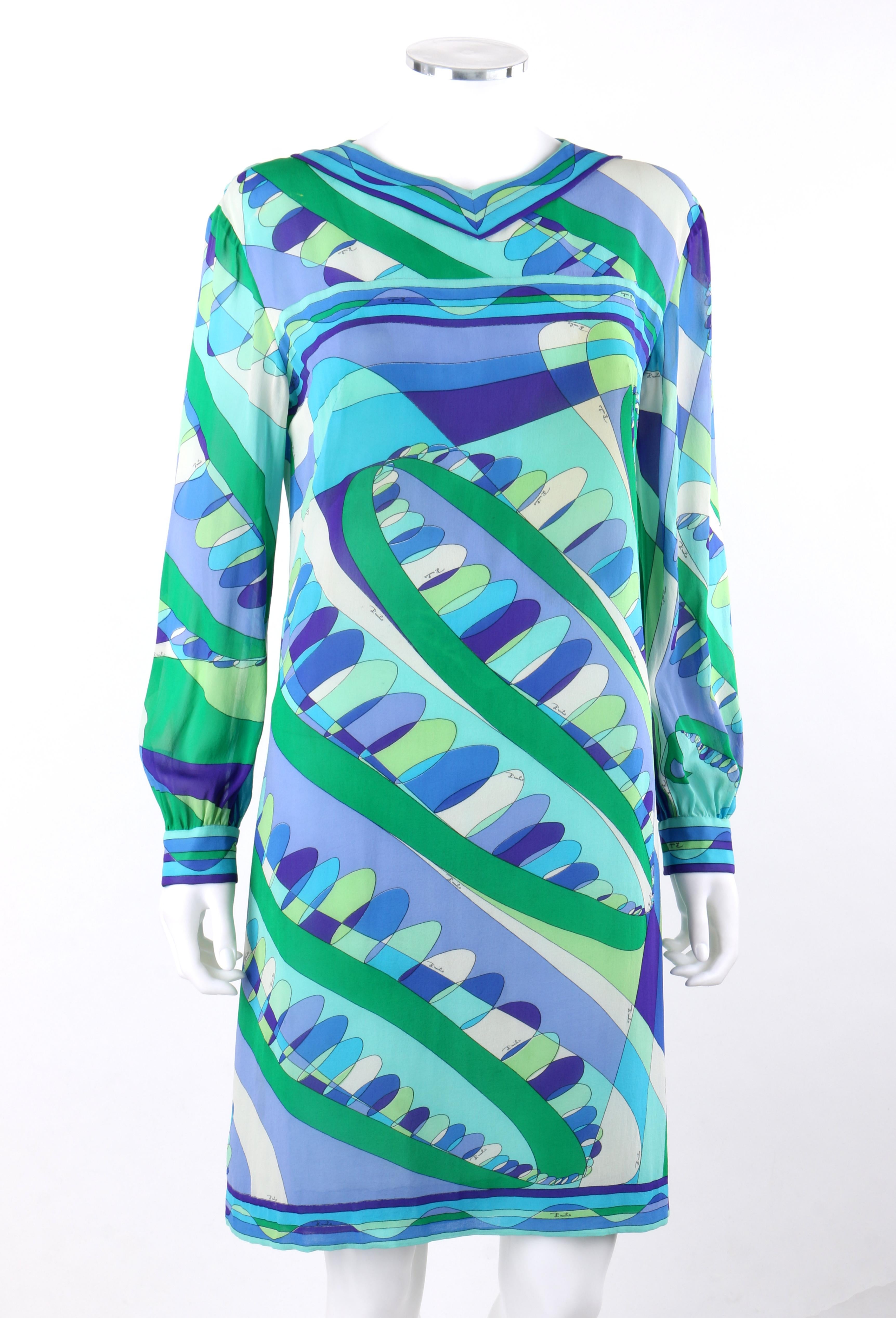 EMILIO PUCCI c.1960’s Blue Multi-Color Op Art Signature Print Sheath Dress
 
Circa: 1960’s 
Label(s): Emilio Pucci   
Style: Sheath Dress
Color(s): Shades of blue, green, off-white, black. 
Lined: No
Marked Fabric Content: 100% Silk 
Additional