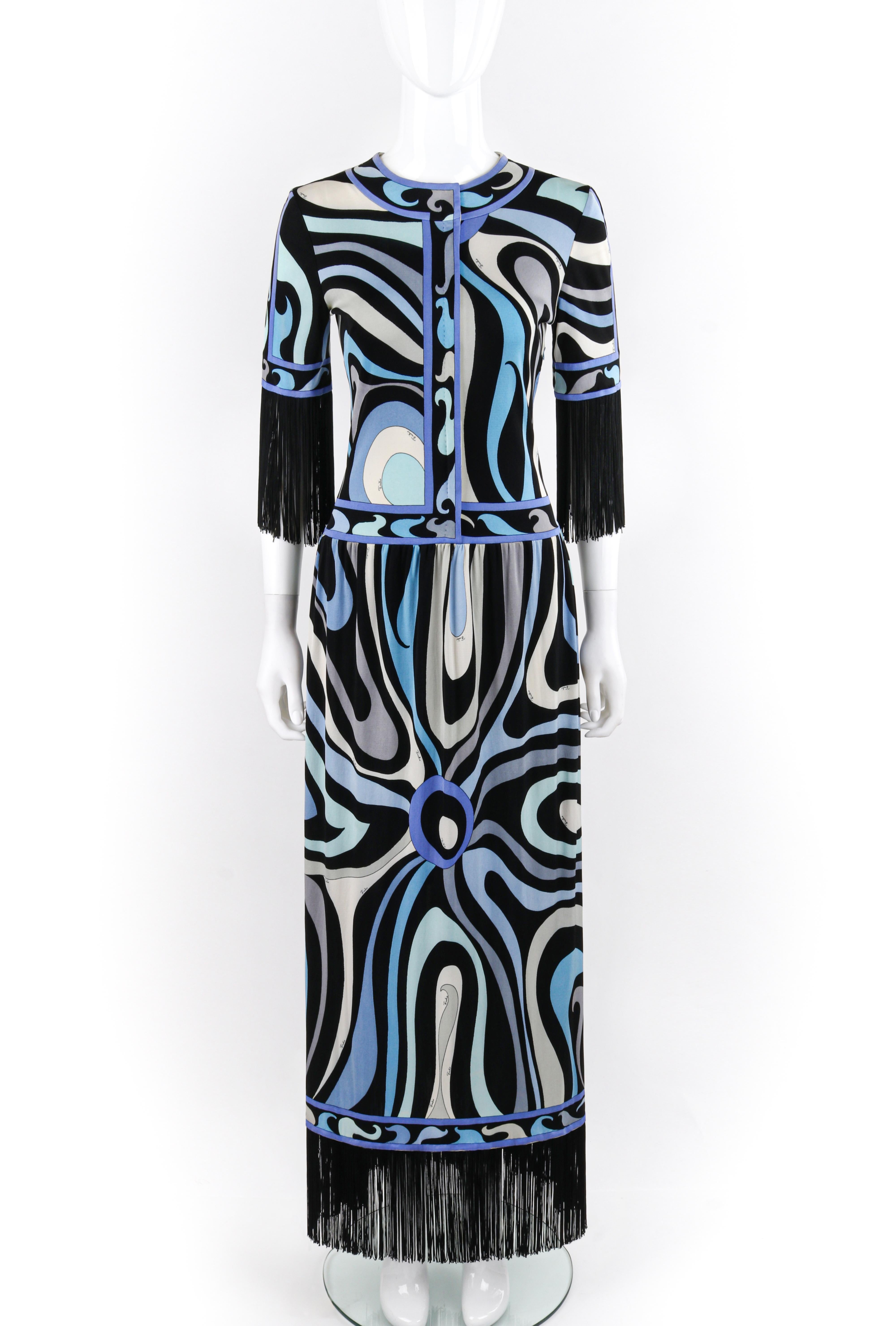 EMILIO PUCCI c.1960’s Blue Signature Op Art Fringe Drop Waist Silk Maxi Dress
Circa: 1960’s
Label(s): Emilio Pucci
Designer: Emilio Pucci
Style: Maxi dress
Color(s): Shades of blue, white, black, purple
Lined: No
Marked Fabric Content: “100% Pure