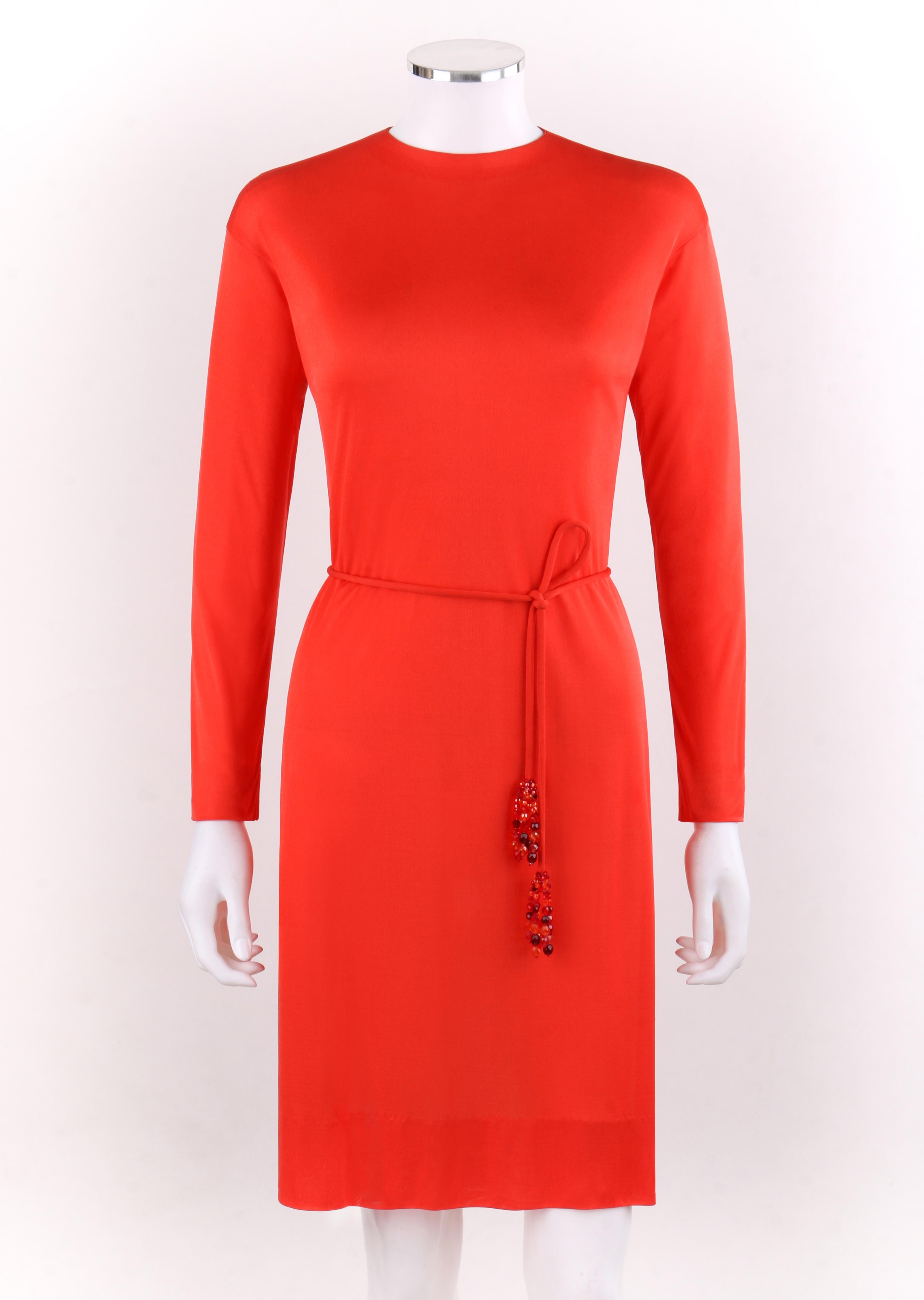 EMILIO PUCCI c.1960’s Coppola E Toppo Belted Scarlet Red Silk Jersey Dress
 
Circa: 1960’s 
Label(s): Emilio Pucci / Exclusively for Neiman Marcus  
Style: Sheath dress
Color(s): Red / Orange
Lined: No
Marked Fabric Content: 100% Silk 
Additional