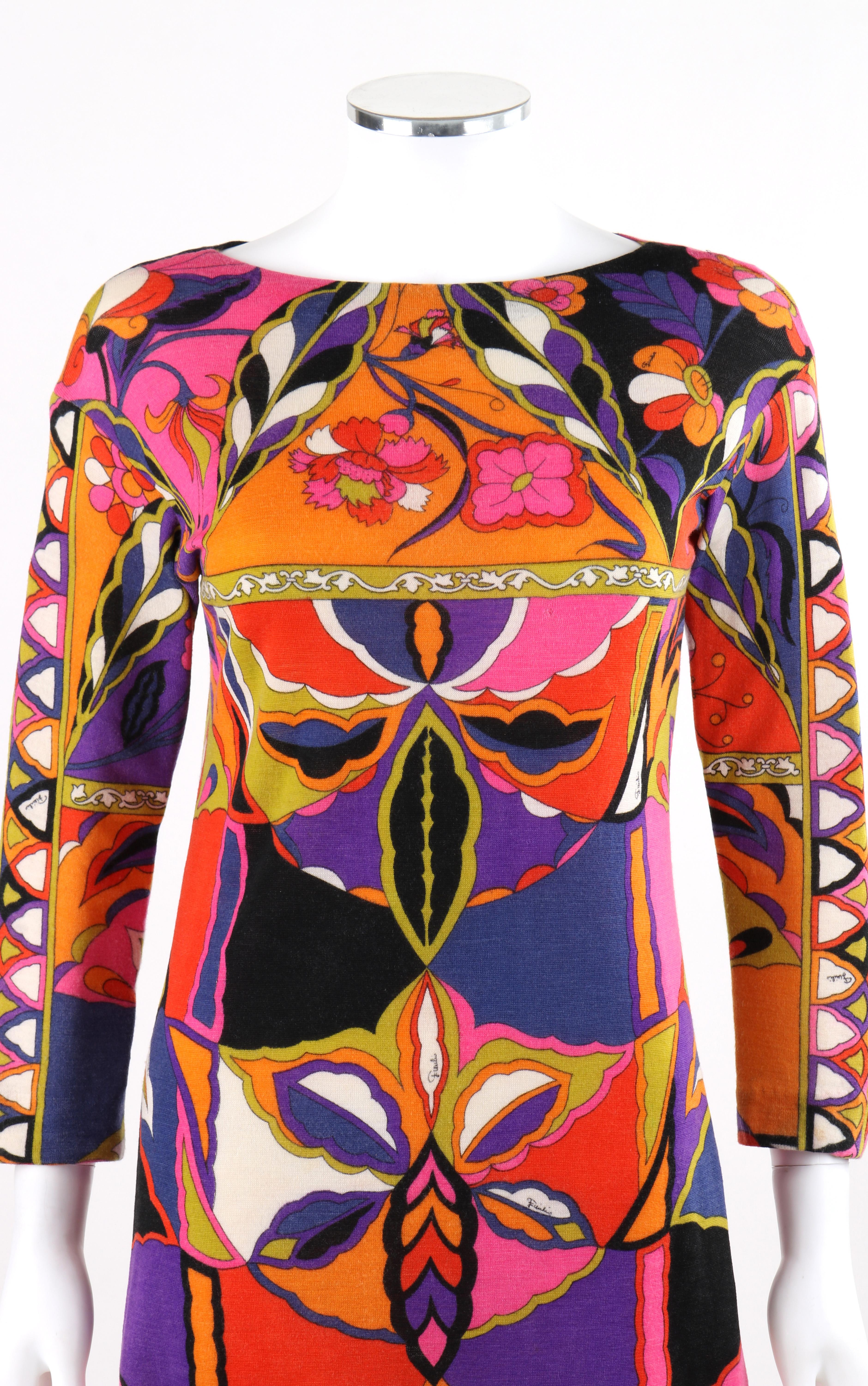 EMILIO PUCCI c.1960’s Geometric Floral Signature Print Cashmere Knit Shift Dress
Circa: 1960’s  
Label(s): Emilio Pucci; Made in Italy for Lord & Taylor 
Designer: Emilio Pucci 
Style: Shift dress
Color(s): Shades of orange, purple. black, white,