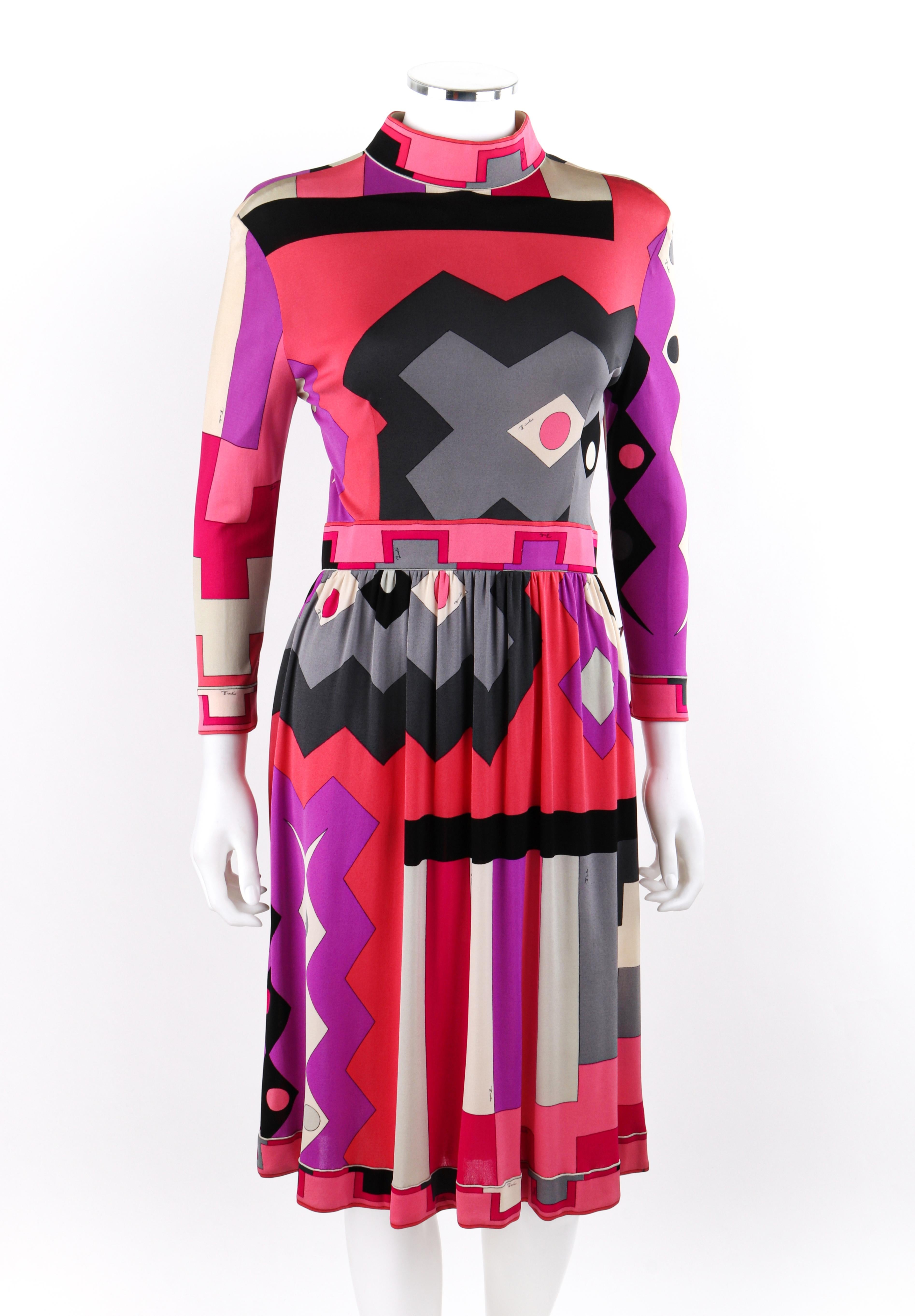 EMILIO PUCCI c.1960s Geometric Stripe Abstract Signature Print Belted Dress
 
Circa: 1960’s
Label(s): Emilio Pucci
Designer: Emilio Pucci
Style: Fit n flare dress
Color(s): Shades of pink, purple, white, gray, black (exterior, interior)
Lined: