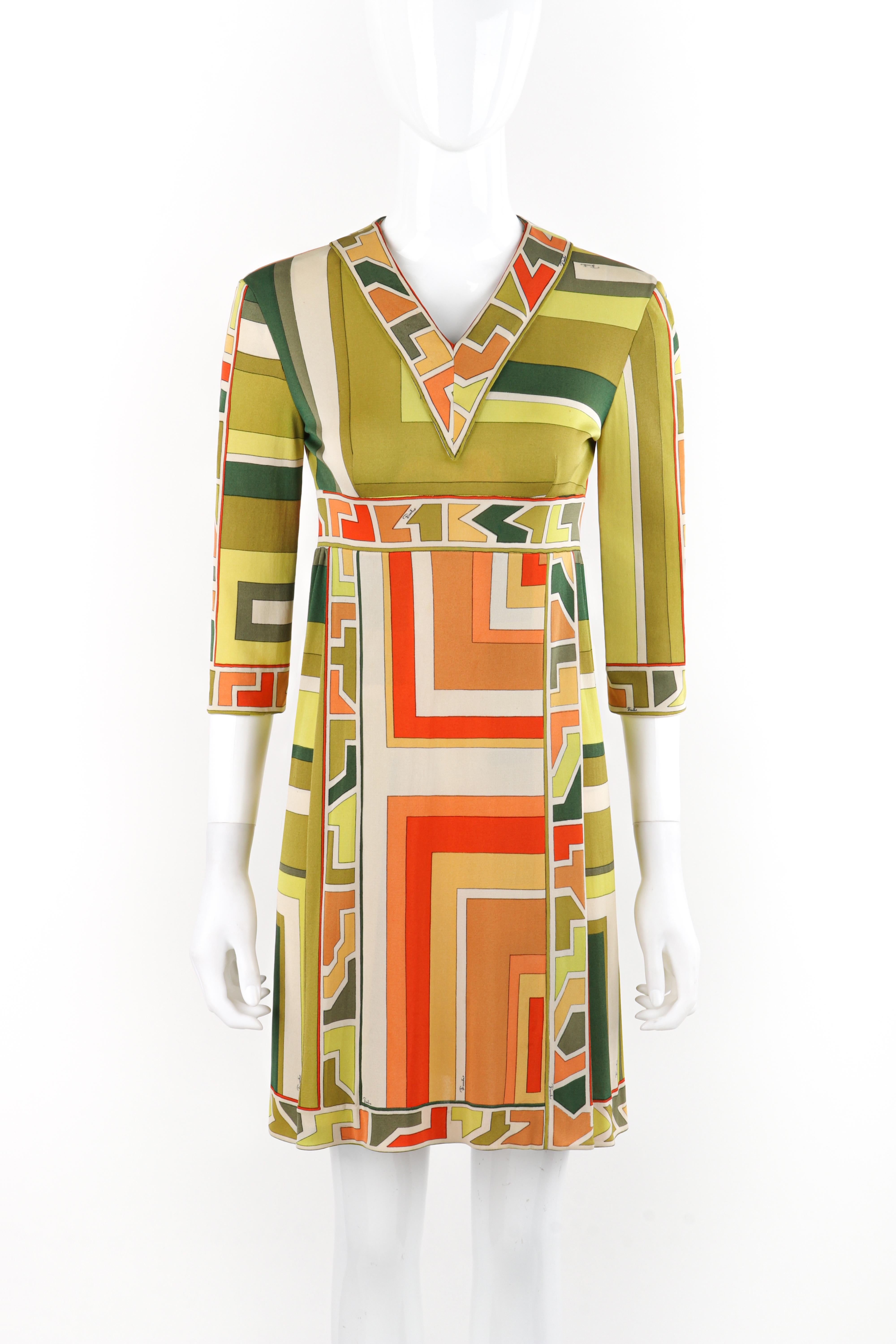 Brand / Manufacturer: Emilio Pucci 
Circa: 1960s
Designer: Emilio Pucci 
Style: Knee-length dress
Color(s): Shades of green, orange, yellow, white, black
Lined: No
Marked Fabric Content: 