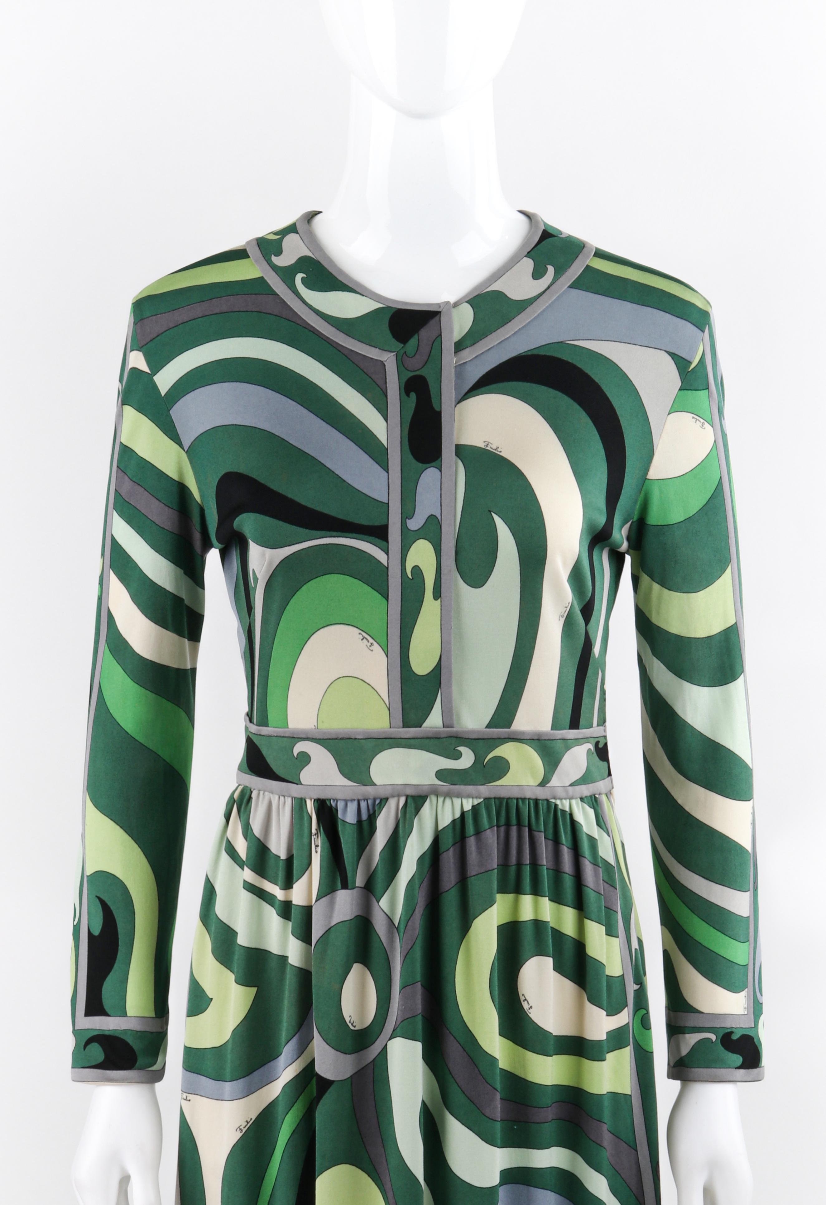 EMILIO PUCCI c.1960’s Green Signature Op Art Long Sleeve Silk Jersey Shift Dress

Circa: 1960’s
Label(s): Emilio Pucci; Made in Italy for Lord & Taylor
Designer: Emilio Pucci
Style: Shift dress
Color(s): Shades of green, gray, white, black, and