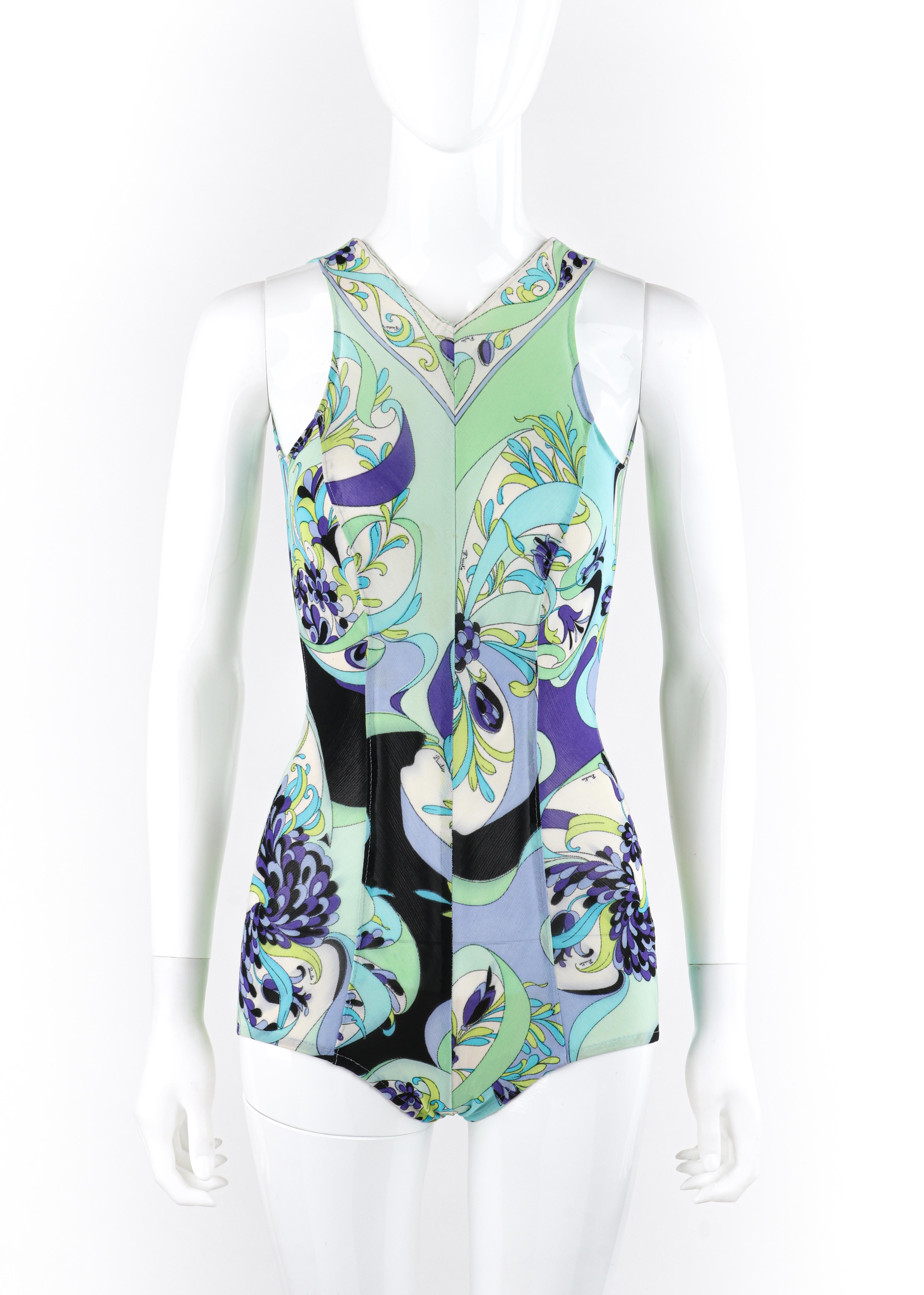 EMILIO PUCCI c.1960s Multicolor Signature Floral Mesh One Piece Bathing Swimsuit
Circa: 1960s 
Label(s): Emilio Pucci, Exclusively for Saks Fifth Avenue
Designer: Emilio Pucci
Style: One-piece swimsuit
Color(s): Shades of blue, purple, green, black,