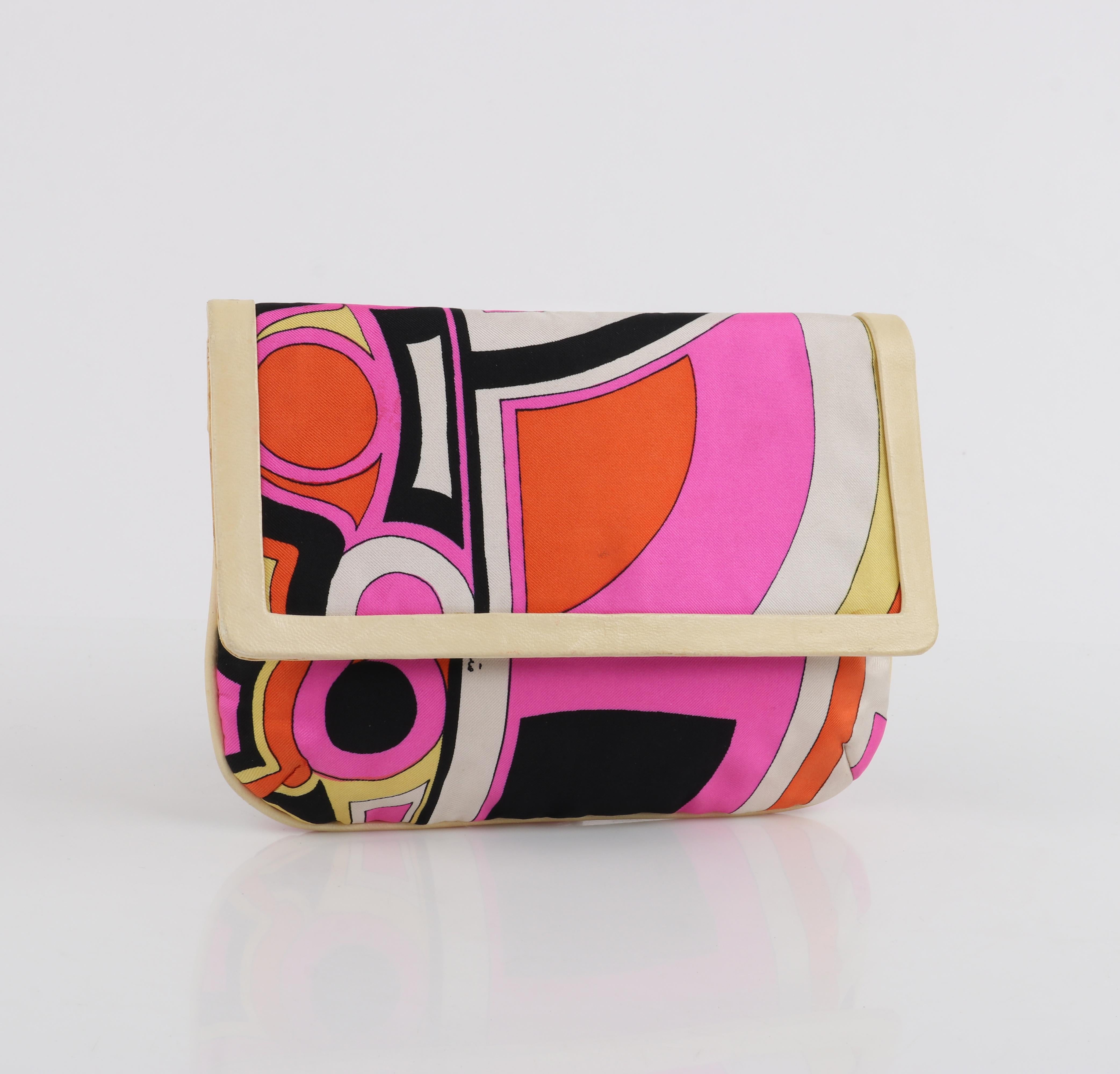 EMILIO PUCCI c.1960's Multicolor Silk & Leather Op Art Geometric Print Clutch Bag

Circa: c.1960's
Label(s): Emilio Pucci by Jana
Designer: Emilio Pucci
Style: Flap clutch
Color(s): Multicolor; Silk exterior: shades of pink, orange, black, white,