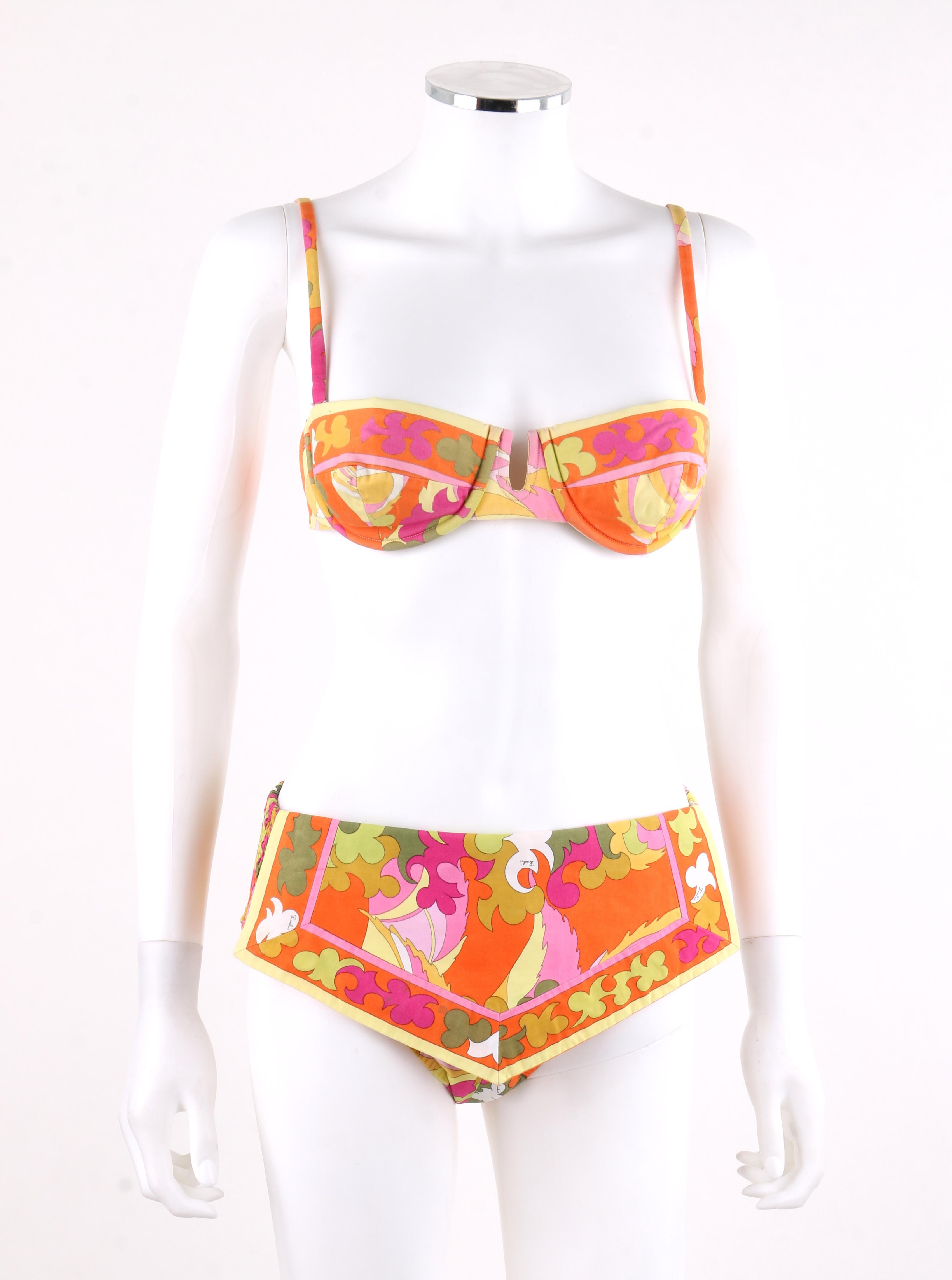 EMILIO PUCCI c.1970’s Multi-color Signature Print 2 Pc Bikini Swimsuit
 
Circa: 1970’s
Label(s): Emilio Pucci / Exclusively for Sak’s Fifth Avenue  
Style: Bikini
Color(s): Shades of orange, pink, green, yellow and white. 
Lined: Yes
Marked Fabric