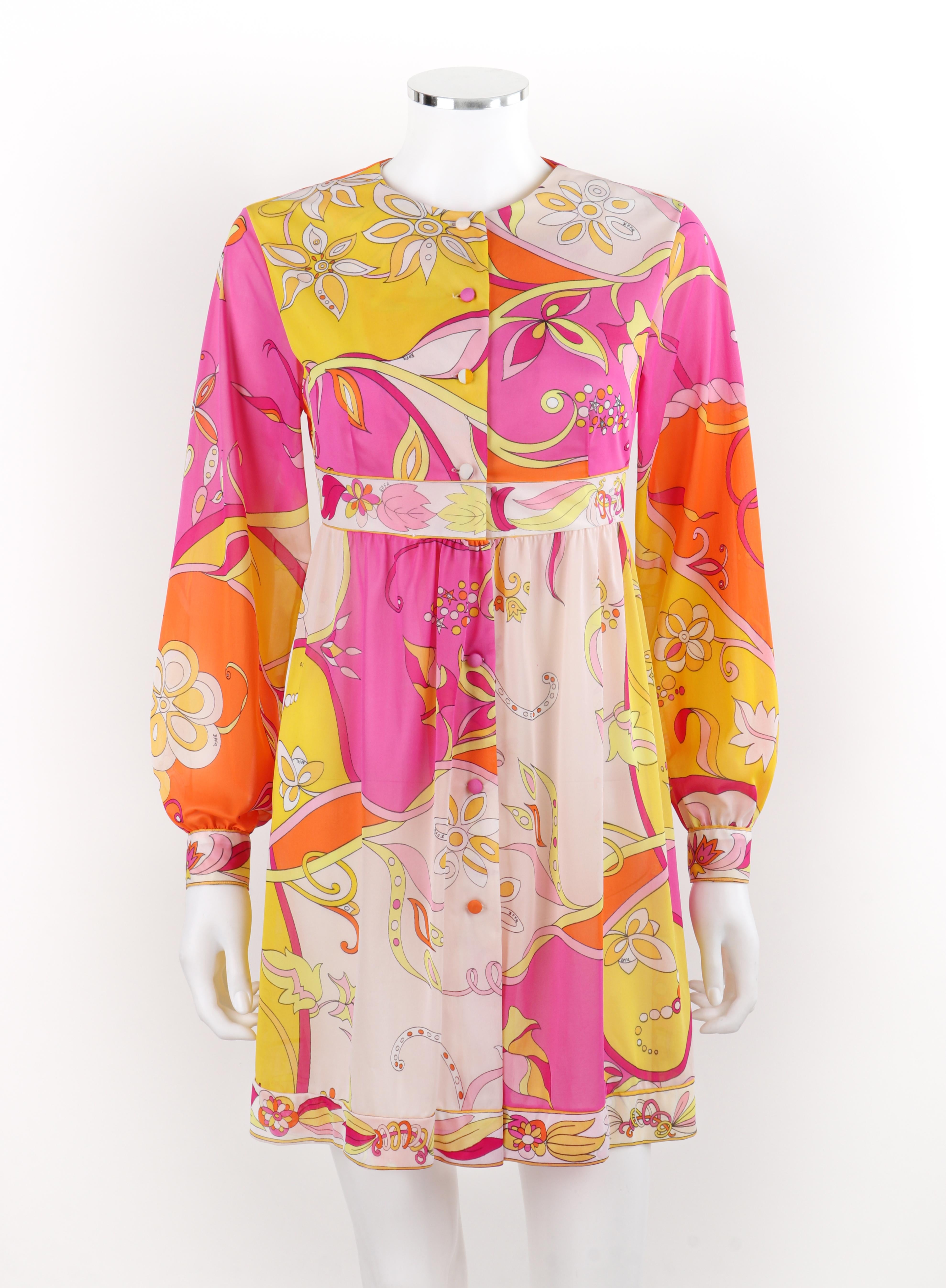 Brand / Manufacturer: Emilio Pucci
Circa: 1970s
Designer: Emilio Pucci
Style: Babydoll dress
Color(s): Shades of pink, yellow, orange, white
Lined: No
Unmarked Fabric Content (feel of): Silk (primary fabric), metal (hardware)
Additional Details /