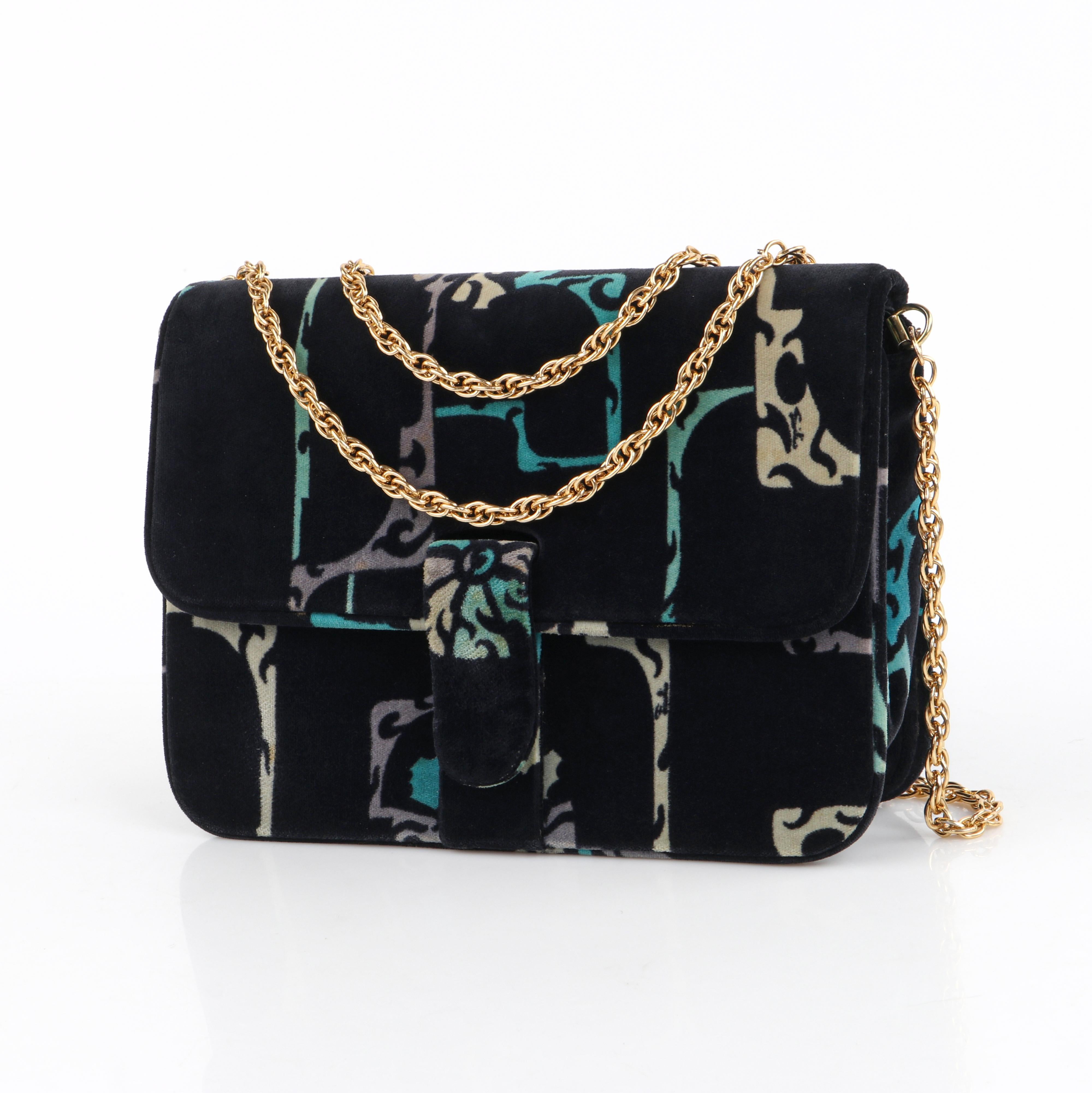 EMILIO PUCCI c.1970's Multicolor Velvet Print Gold Chain Shoulder Bag Purse

Circa: 1970's
Designer: Emilio Pucci
Style: Shoulder bag
Color(s): Shades of blue, purple, cream, and black.
Lined: Yes
Unmarked Fabric Content: Velvet
Additional Details /