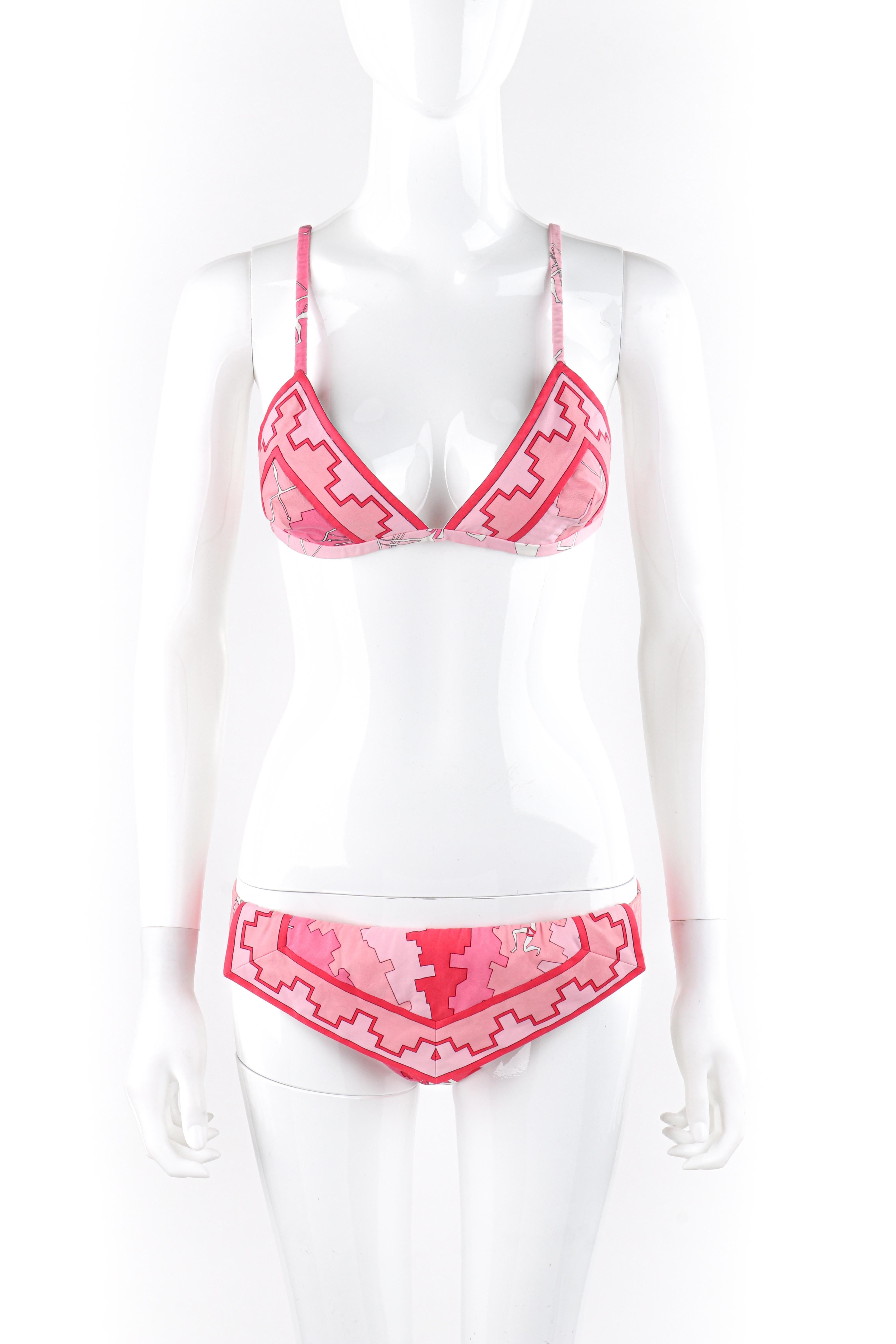 EMILIO PUCCI c.1970s Pink Geometric Novelty Figure 2 Pc Triangle Bikini Swimsuit
Circa: 1970s 
Label(s): Emilio Pucci, Exclusively for Saks Fifth Avenue
Designer: Emilio Pucci 
Style: Bikini
Color(s): Shades of pink, white, black
Lined: Yes
Marked