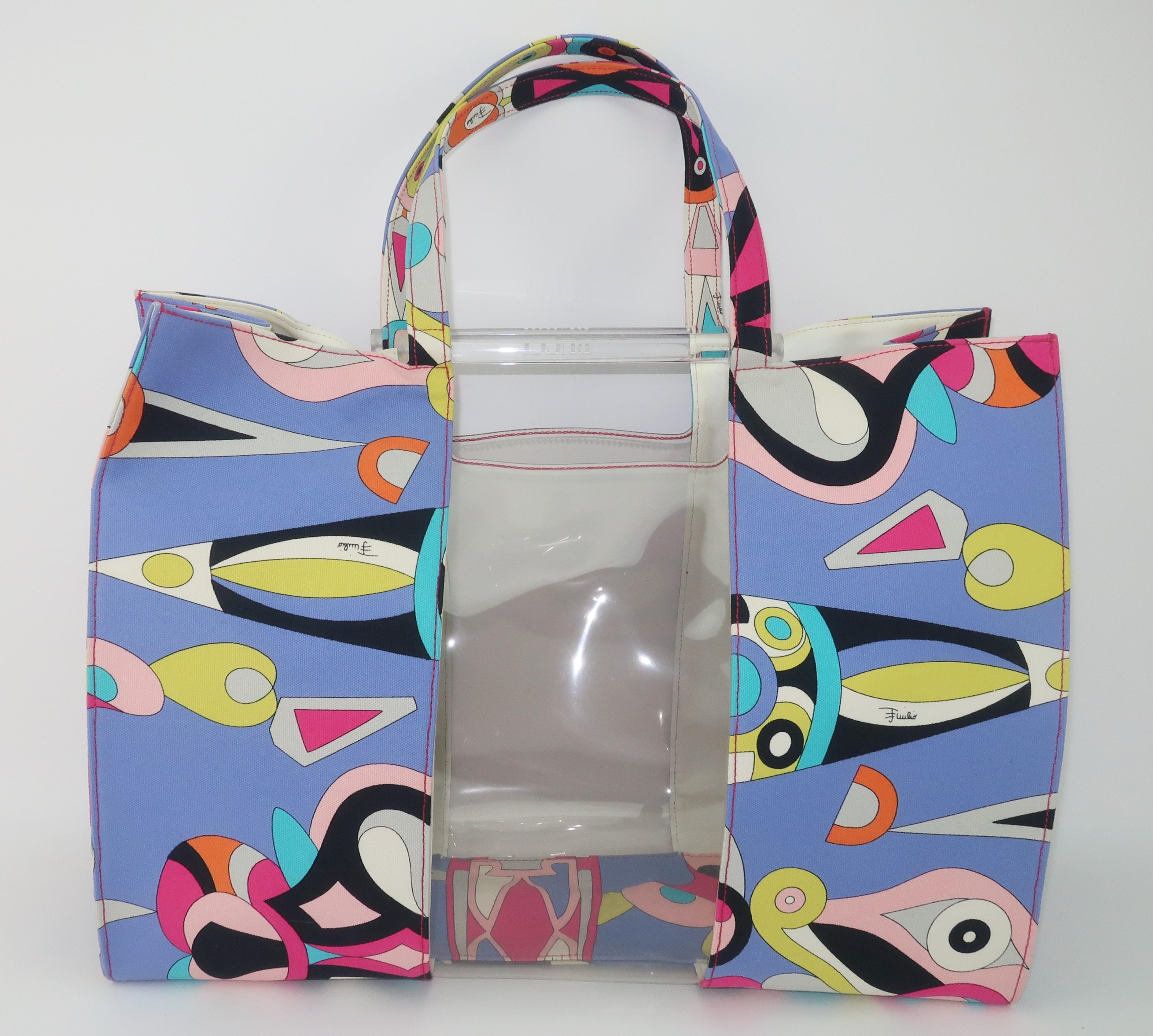 A fun Emilio Pucci canvas tote handbag with a great combination of an iconic psychedelic print and a functional roomy size that would be great for a stylish beach bag or a carryall for casual occasions.  The vibrant Pucci print has a periwinkle blue