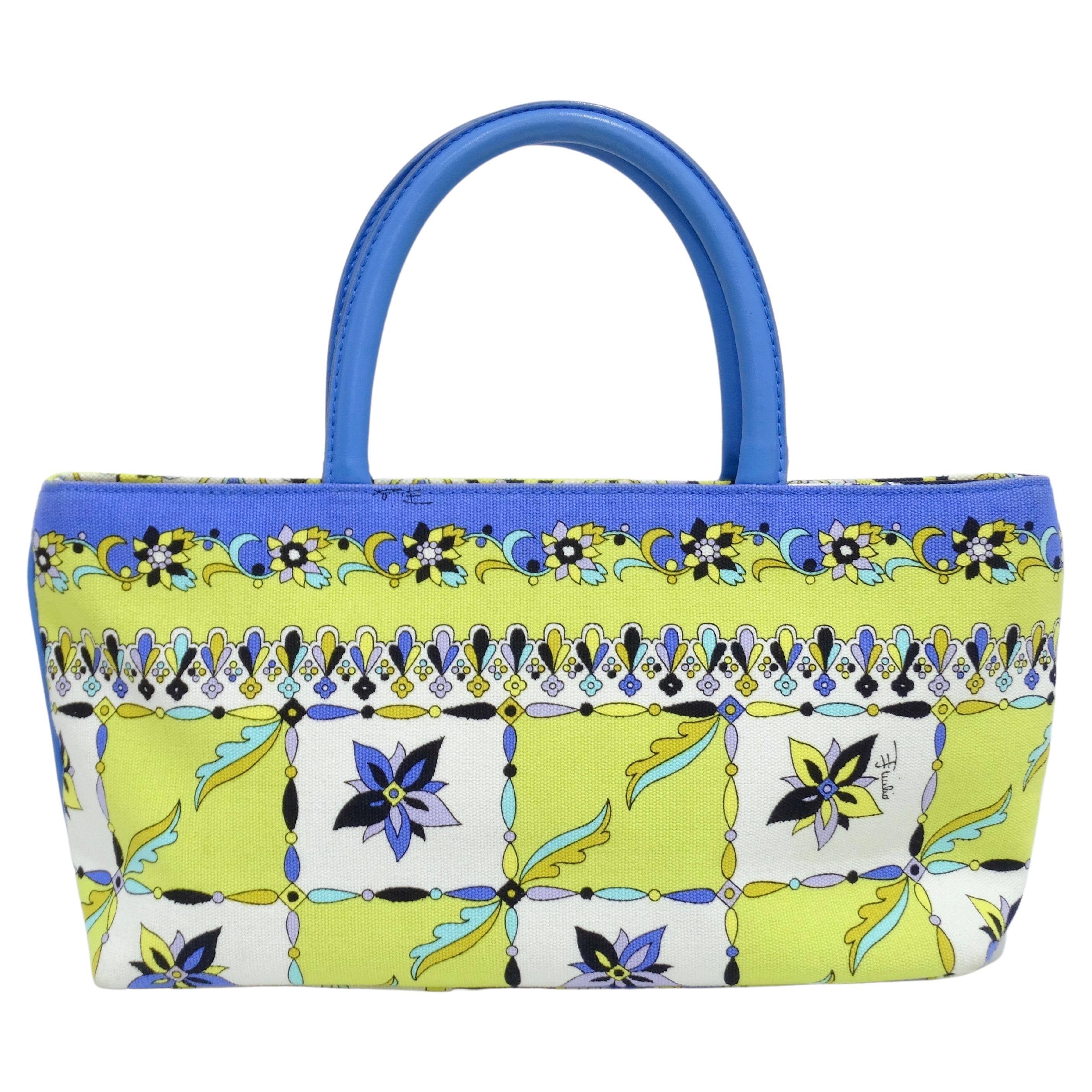 Snag this unique print Pucci bag for the upcoming poolside season. Emilio Pucci is known for his fluid shapes, kaleidoscopic motifs, and bright colors. This bag features a beautiful blue leather handle, intricate flower print with hues of lime
