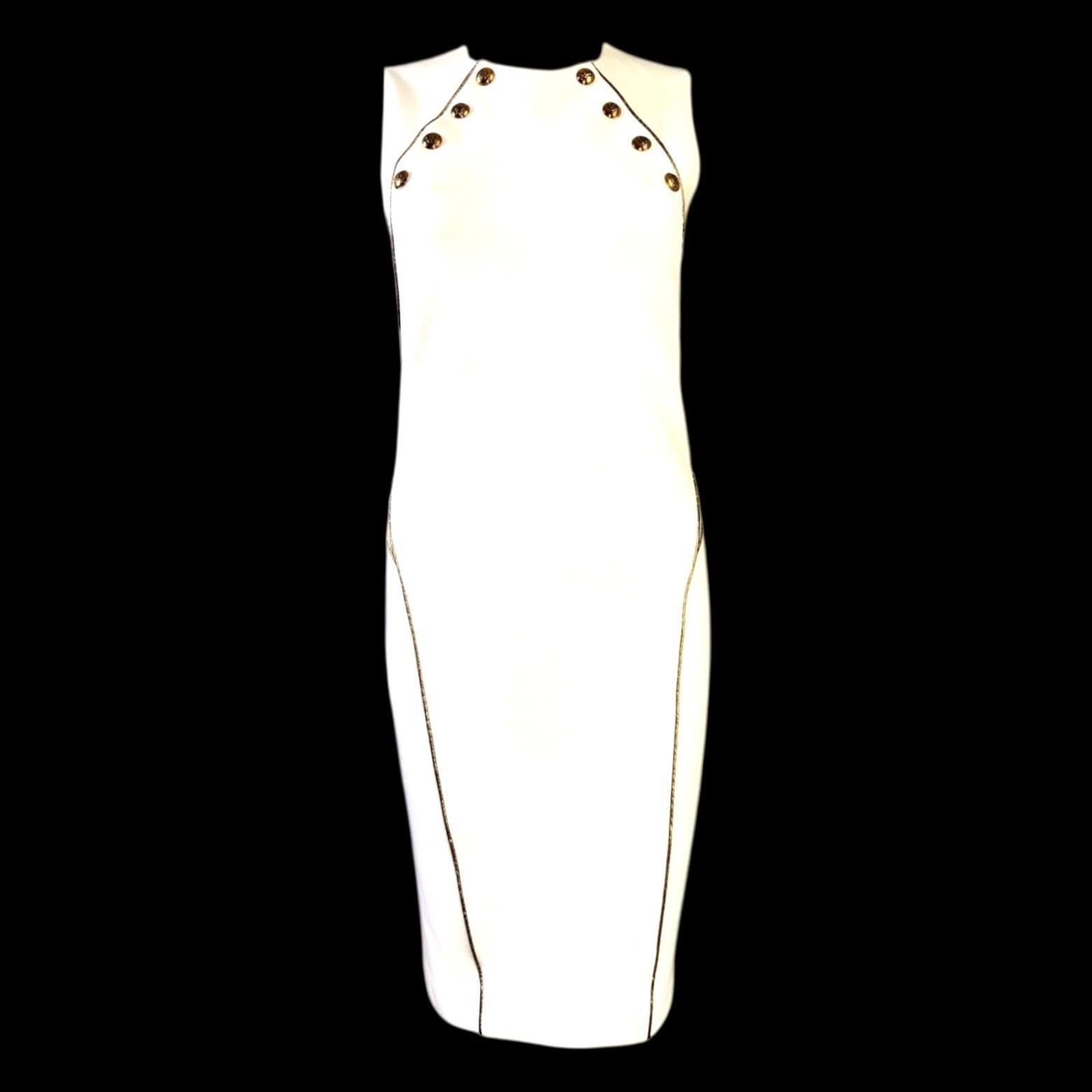 Una pieza impresionante de Emilio Pucci
Vestido escultural 
Se cierra con botones visibles delante y cremallera lateral
Ribetes de tubo en contraste dorado
Herrajes dorados 
Parcialmente forrado
Botones grabados discretamente con el escudo de Emilio