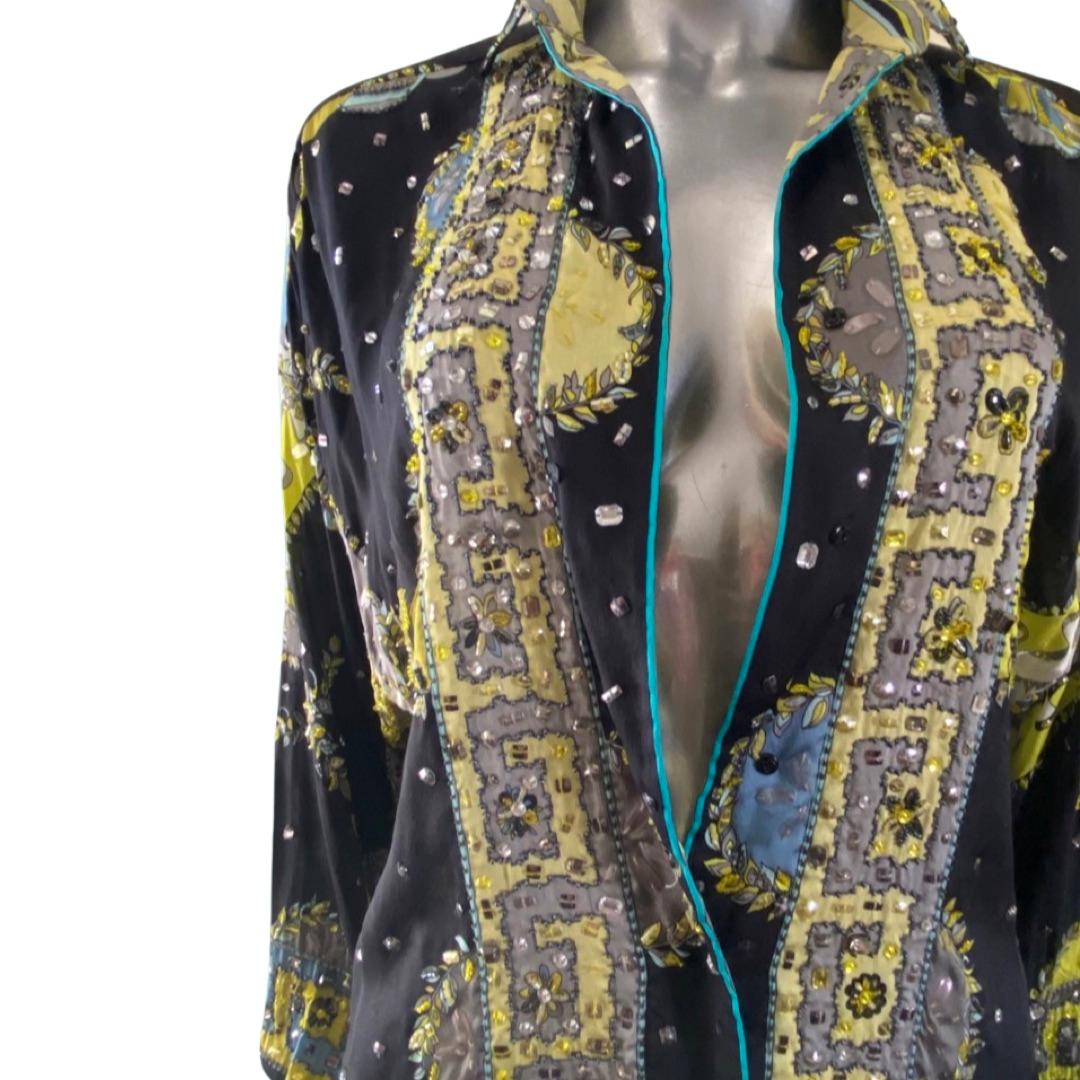 A rare and beautiful silk blouse from Emilio Pucci, Florence Italy. Intricately hand beaded with sequins and beads. Stunning. Size: Italy 40. USA 6. Circa 2005-2010 Pucci collection. hidden snap closure on front placket. A forever classic, alway
