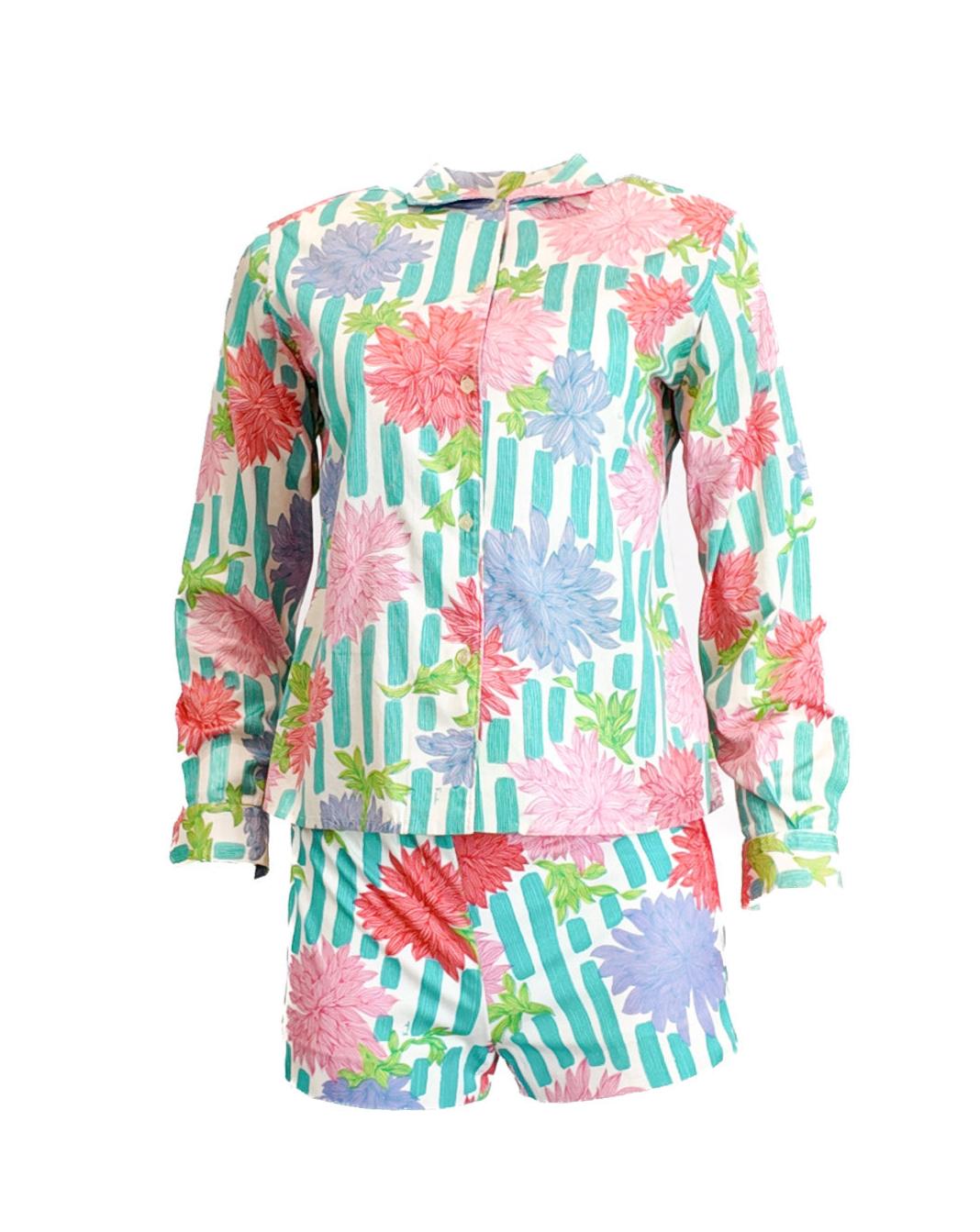 This Emilio Pucci set features a vibrant floral print on breathable 100% cotton fabric, embodying the iconic Palm Royale style. The classic design pairs colorful shorts with a matching top, making it an ideal choice for a stylish and comfortable