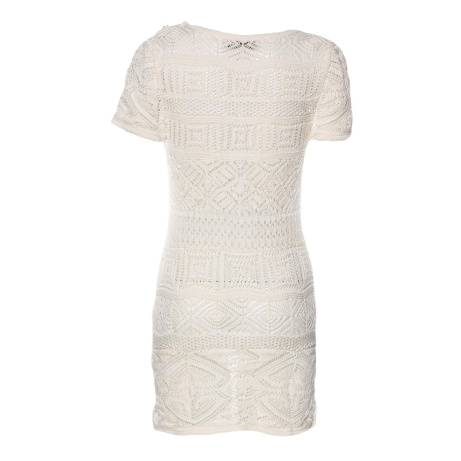 Emilio Pucci's cotton dress is perfect for poolside lounging. This crocheted style has a button-detailed shoulder. Wear it with sandals and oversized sunglasses.

Beautiful Emilio Pucci Mini Dress
Button-style shoulder detail
Simply slips on
Fits US